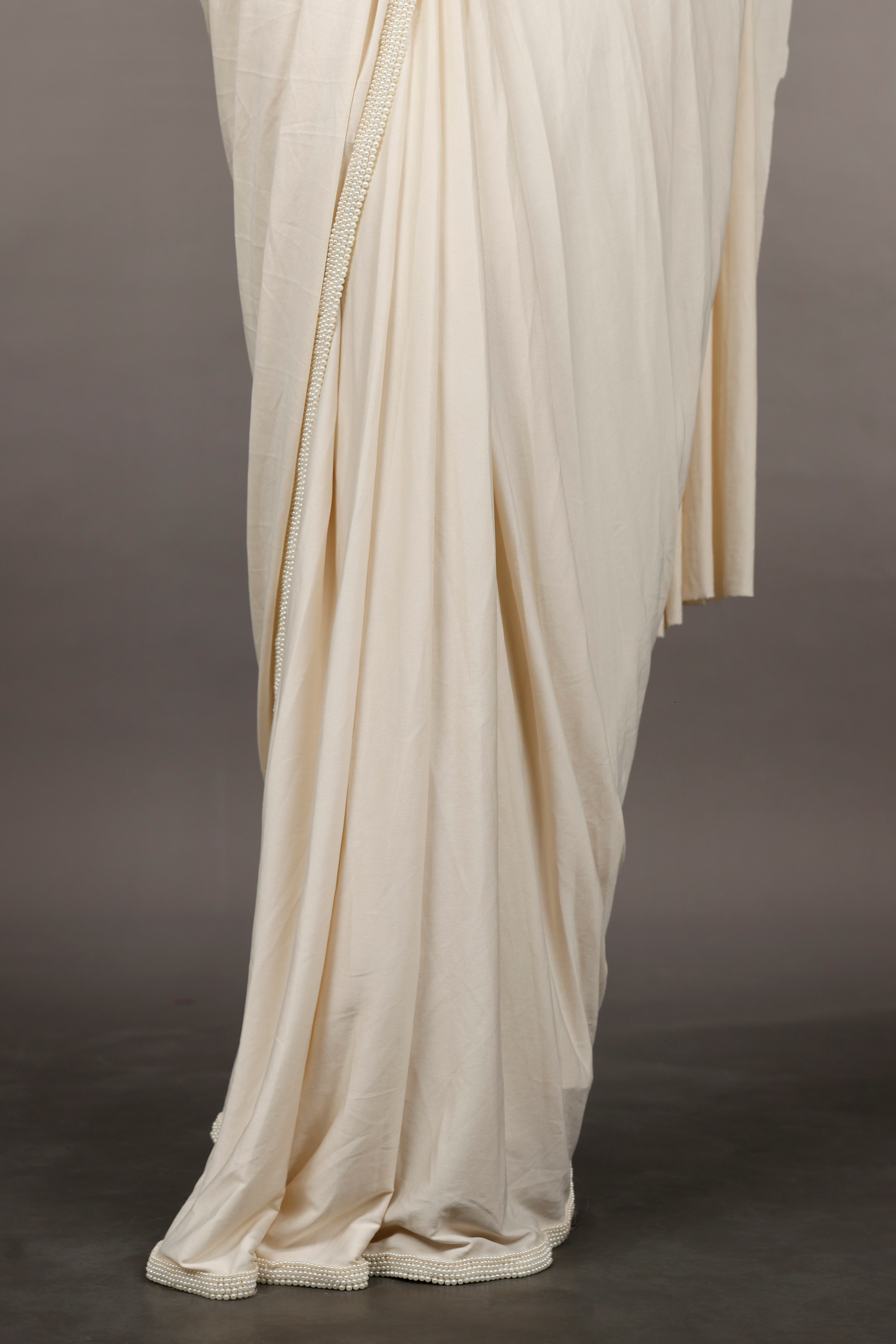Ivory Lycra Drape Saree with Pearl & Stone Embroidered Blouse