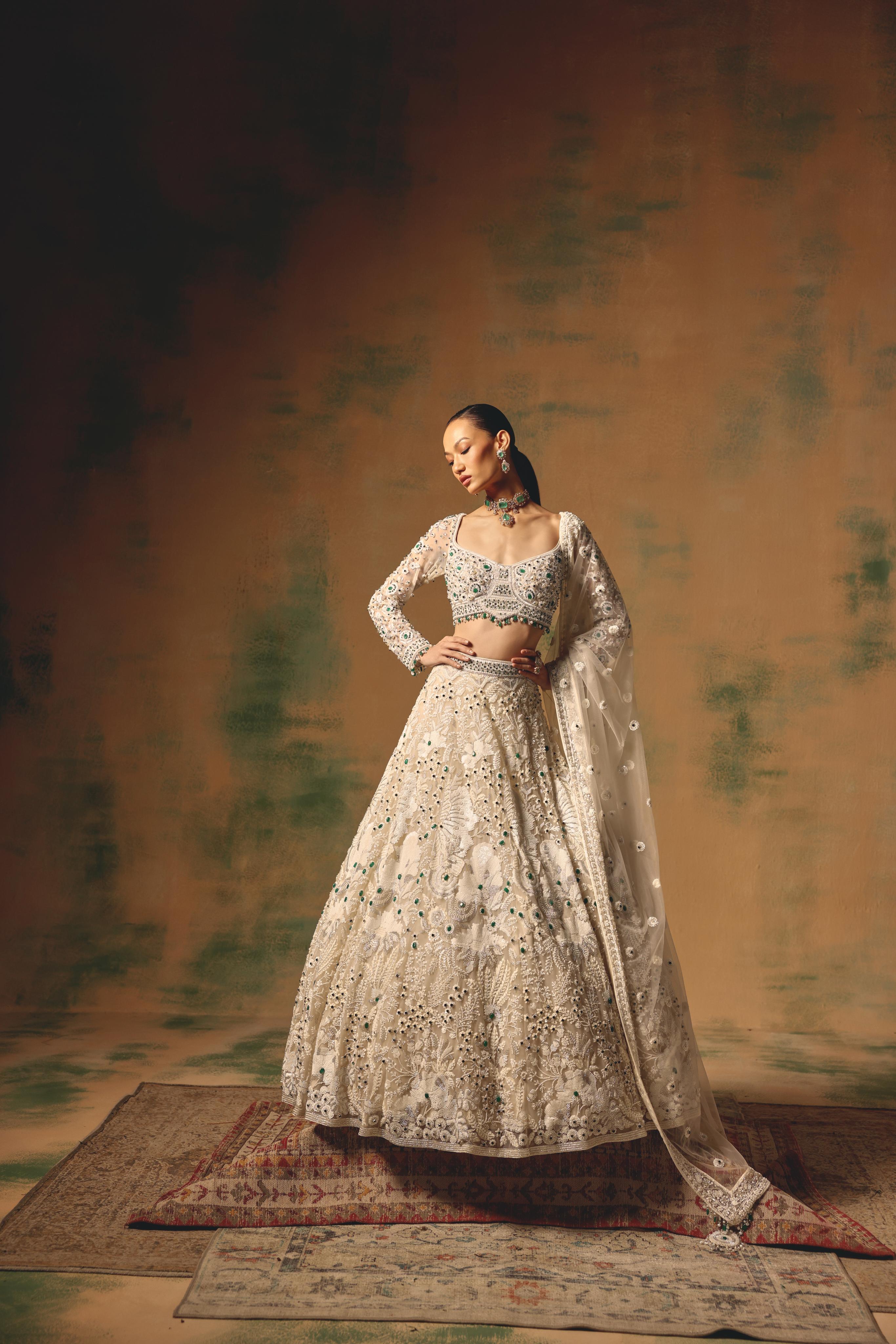 Ivory Net Lehenga with Emerald Embellishments