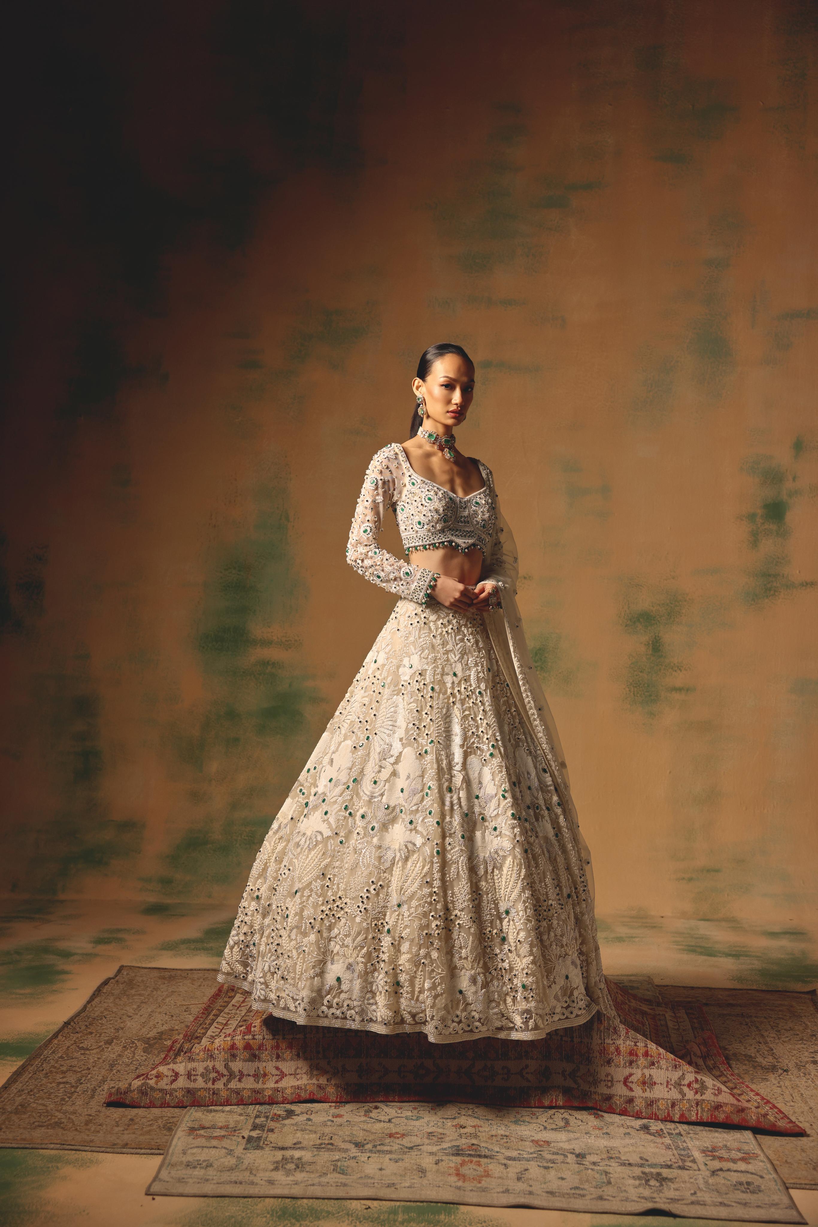 Ivory Net Lehenga with Emerald Embellishments