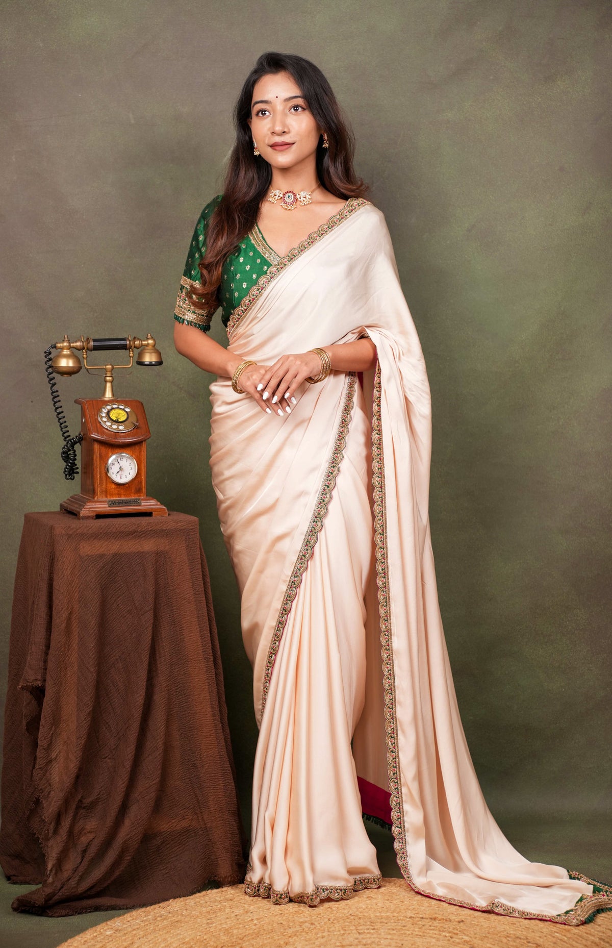 Peach Satin Saree with Green Embroidered Border