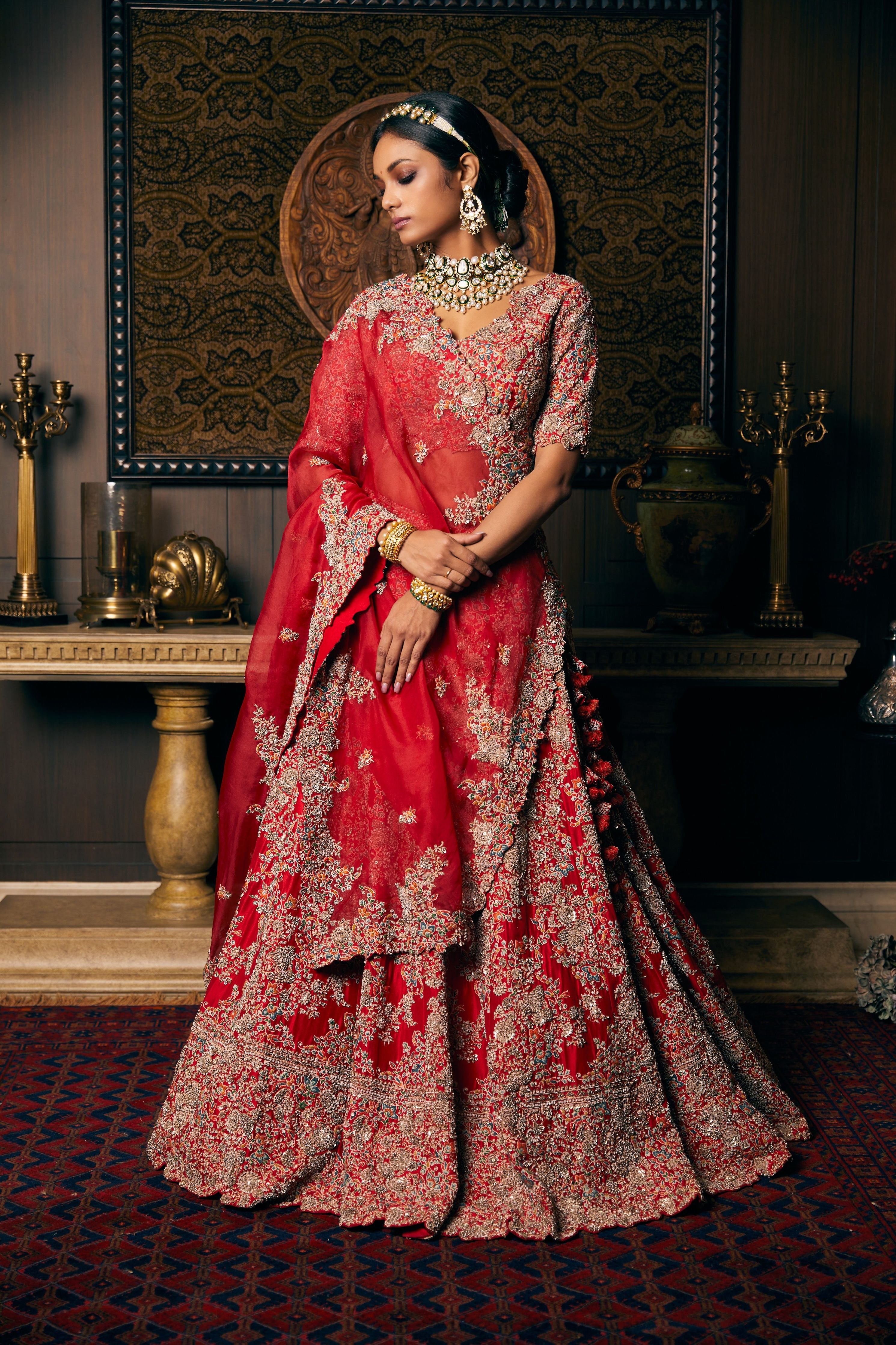 Blood red silk lehenga and blouse with organza dupatta and veil  Mokshaa