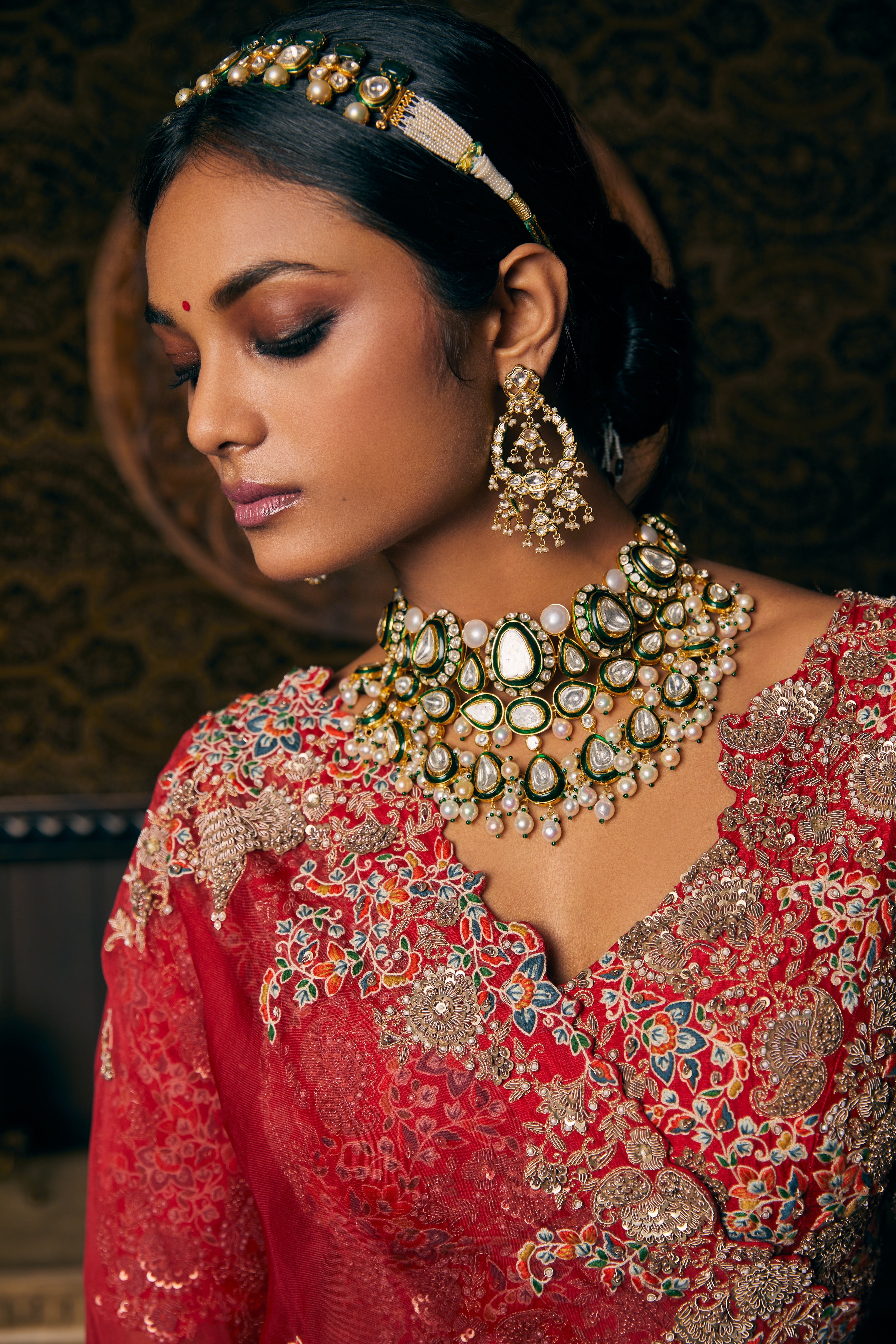 Blood red silk lehenga and blouse with organza dupatta and veil  Mokshaa