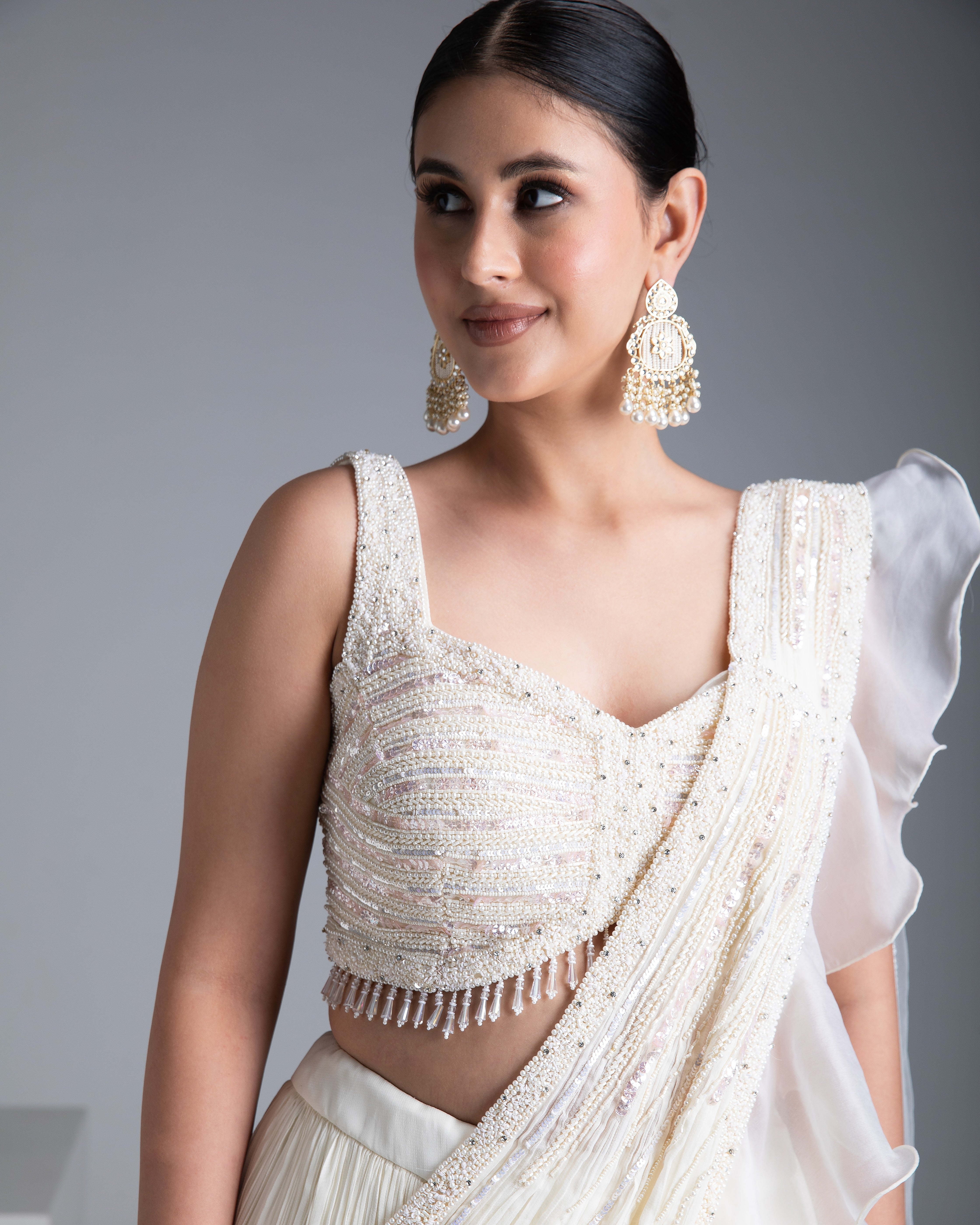 Ivory Georgette Pleated Lehenga Set with Bead and Pearl Embroidered Blouse - Mokshaa