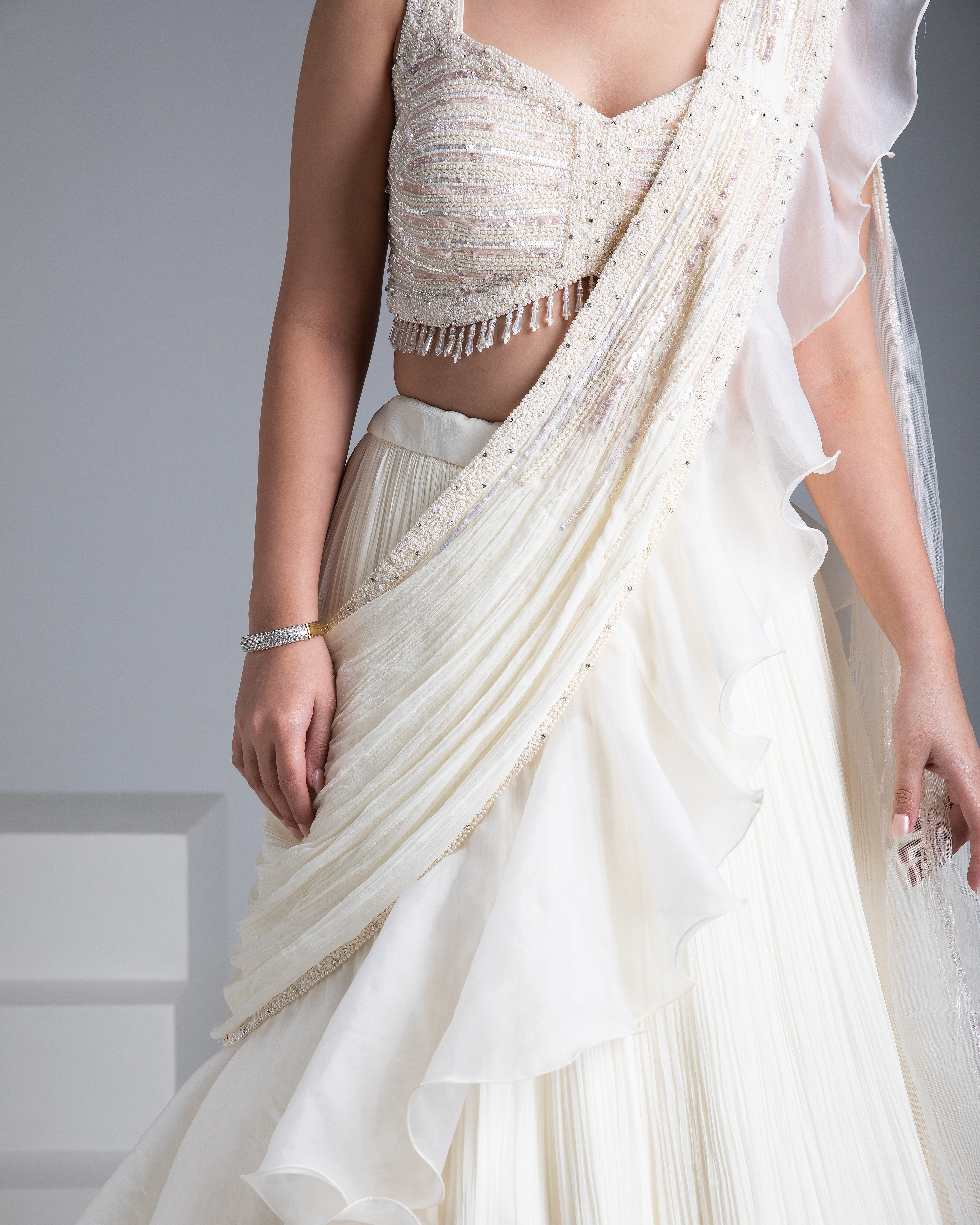 Ivory Georgette Pleated Lehenga Set with Bead and Pearl Embroidered Blouse - Mokshaa