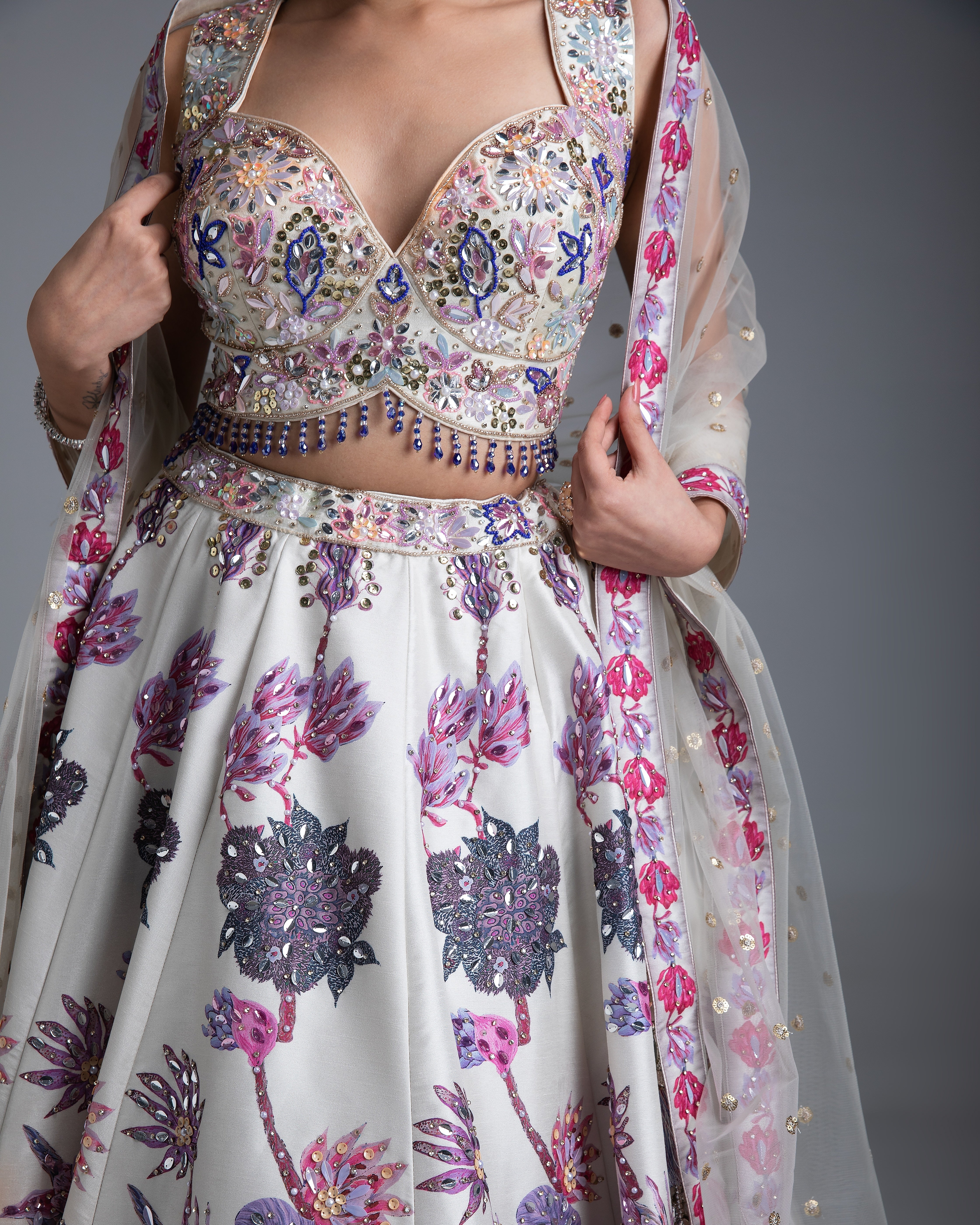 Ivory Silk Lehenga with Multicolor Floral Embroidery and Net Dupatta - Mokshaa