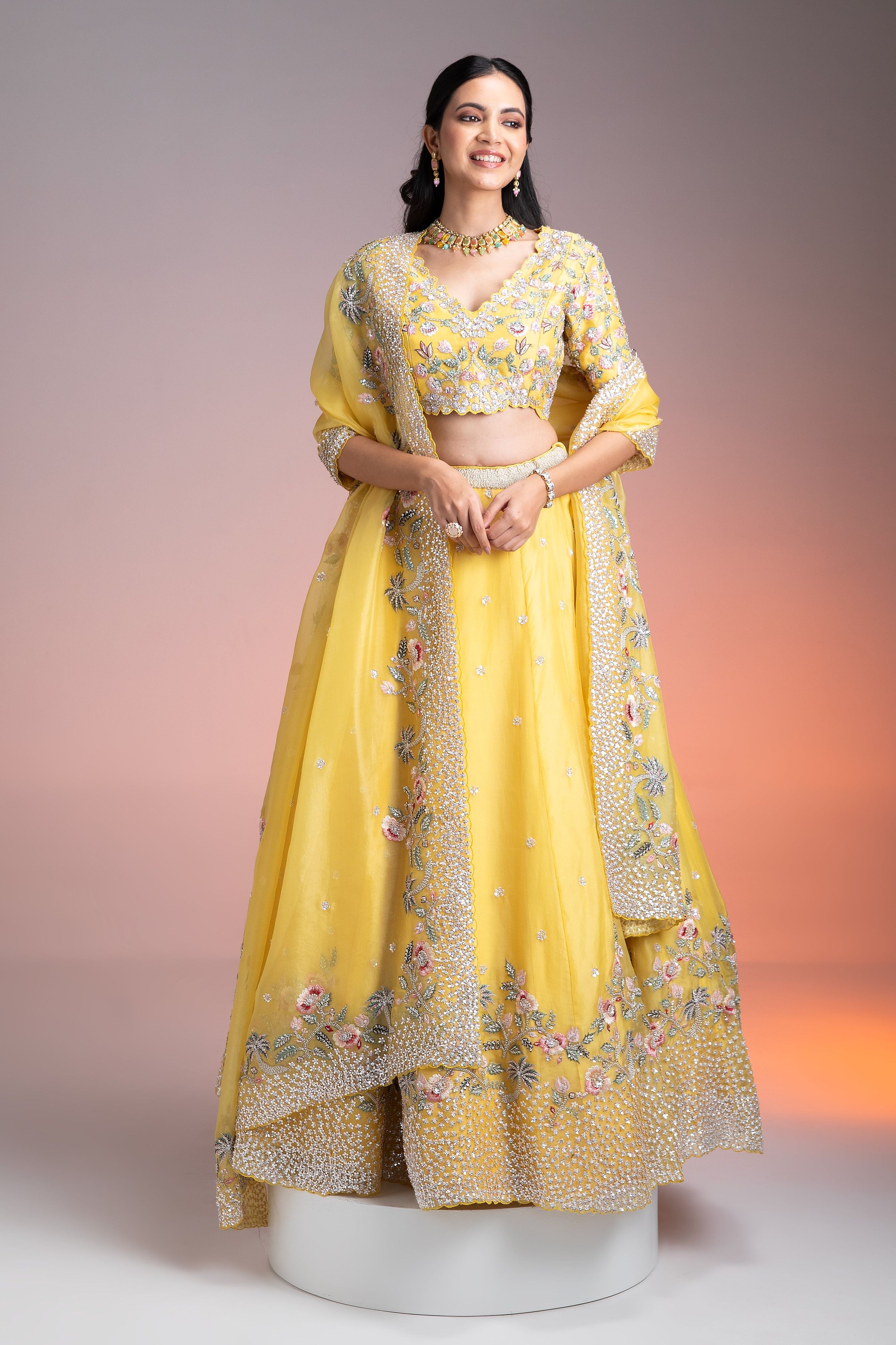 Vibrant Yellow Organza Lehenga with Multicolor Floral Threadwork and Sequins聽 Mokshaa