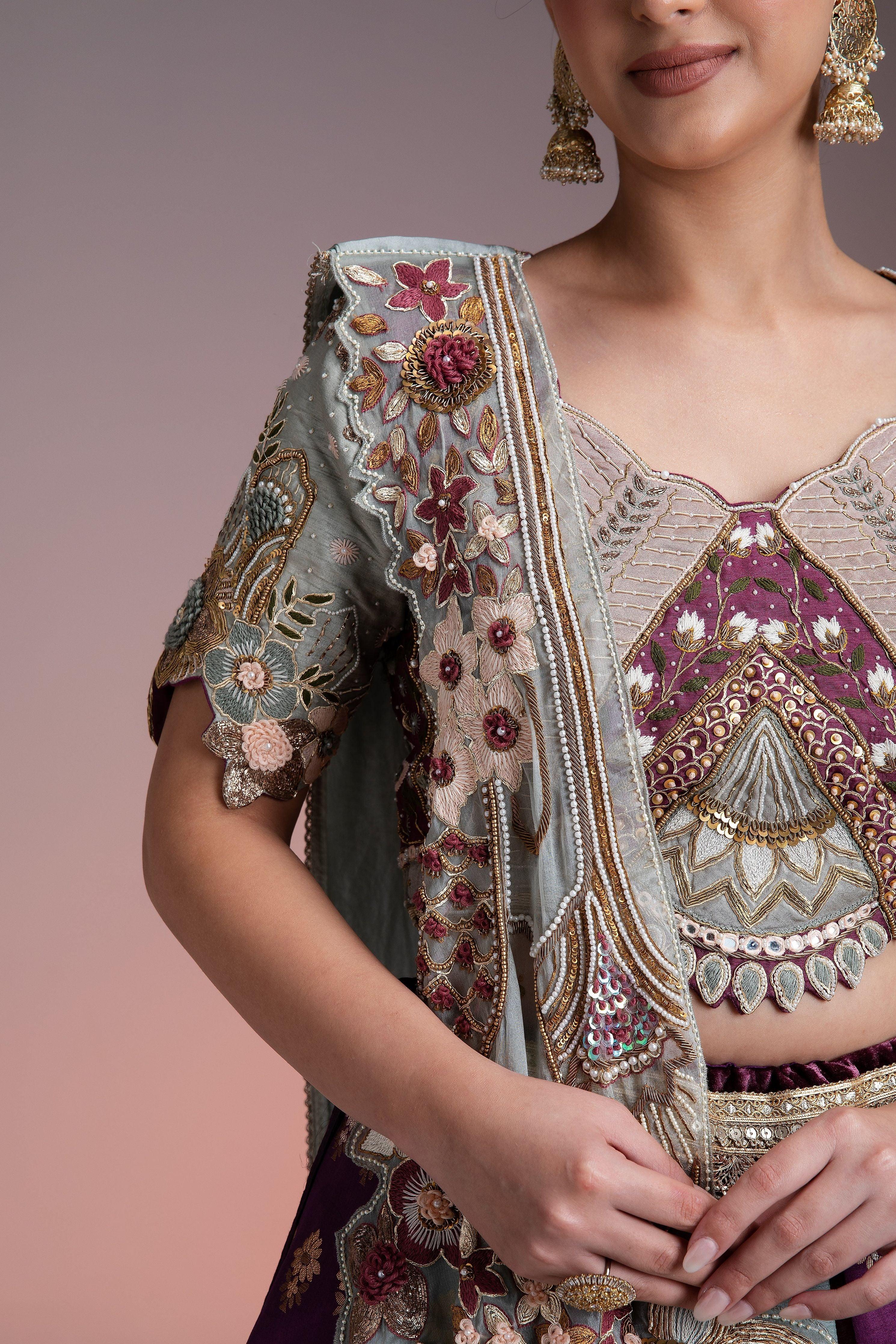 Silk Brocade Lehenga in Muted Pastels and Maroon with Floral Threadwork and Velvet Accents  Mokshaa