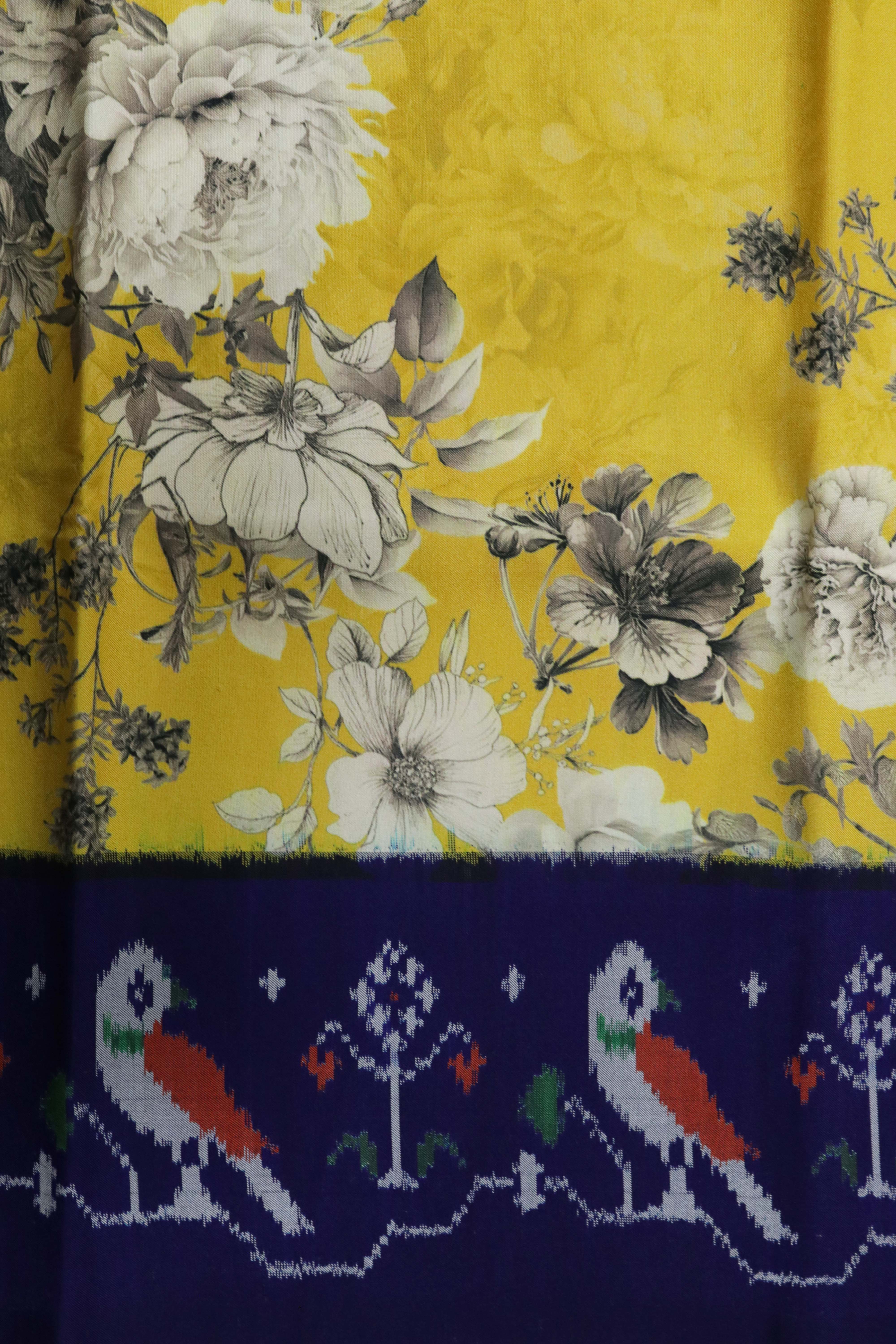 Yellow Printed Silk Saree with Ikat Border