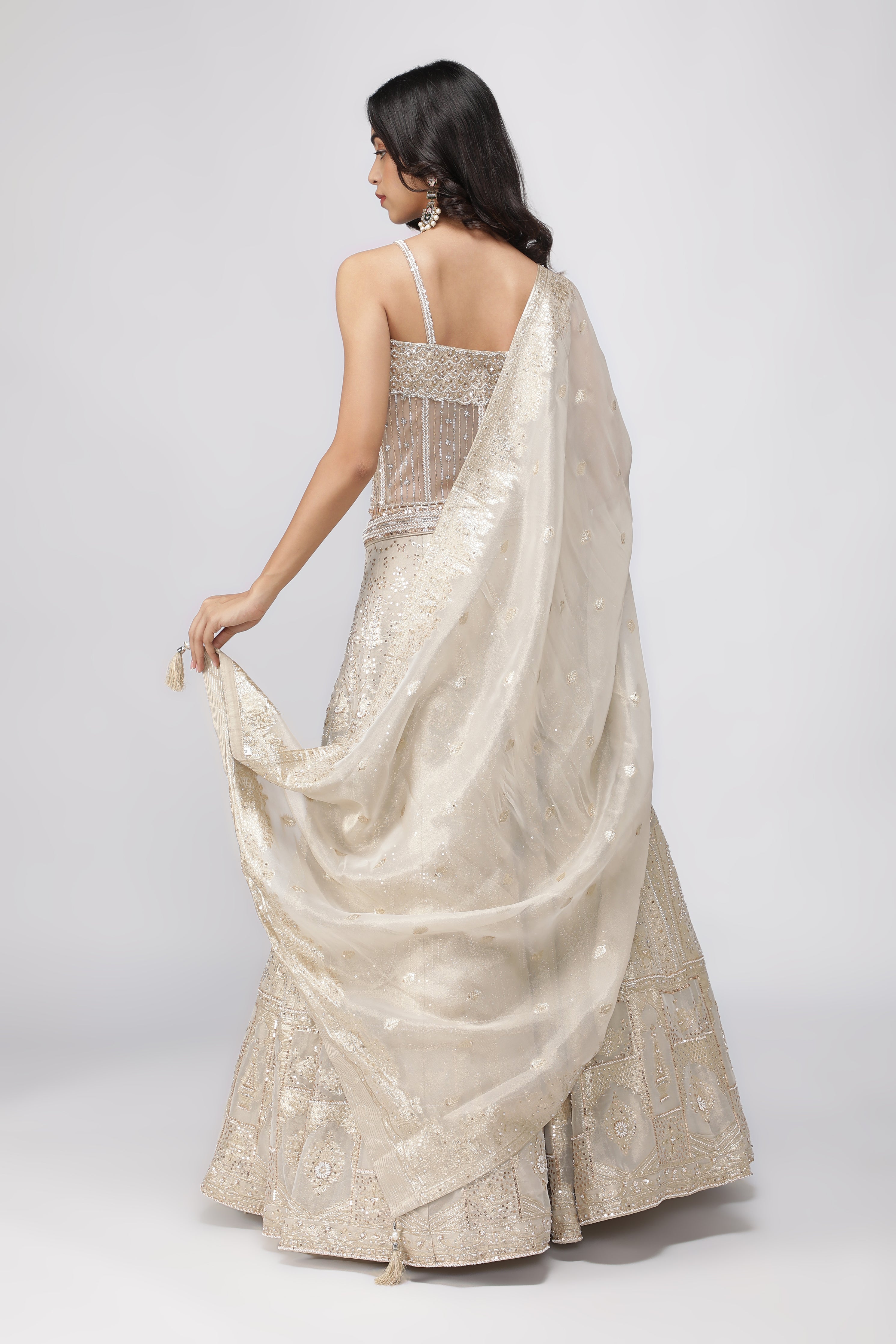 Ivory Banarasi Tissue Lehenga with Pearl Embellished Corset Blouse