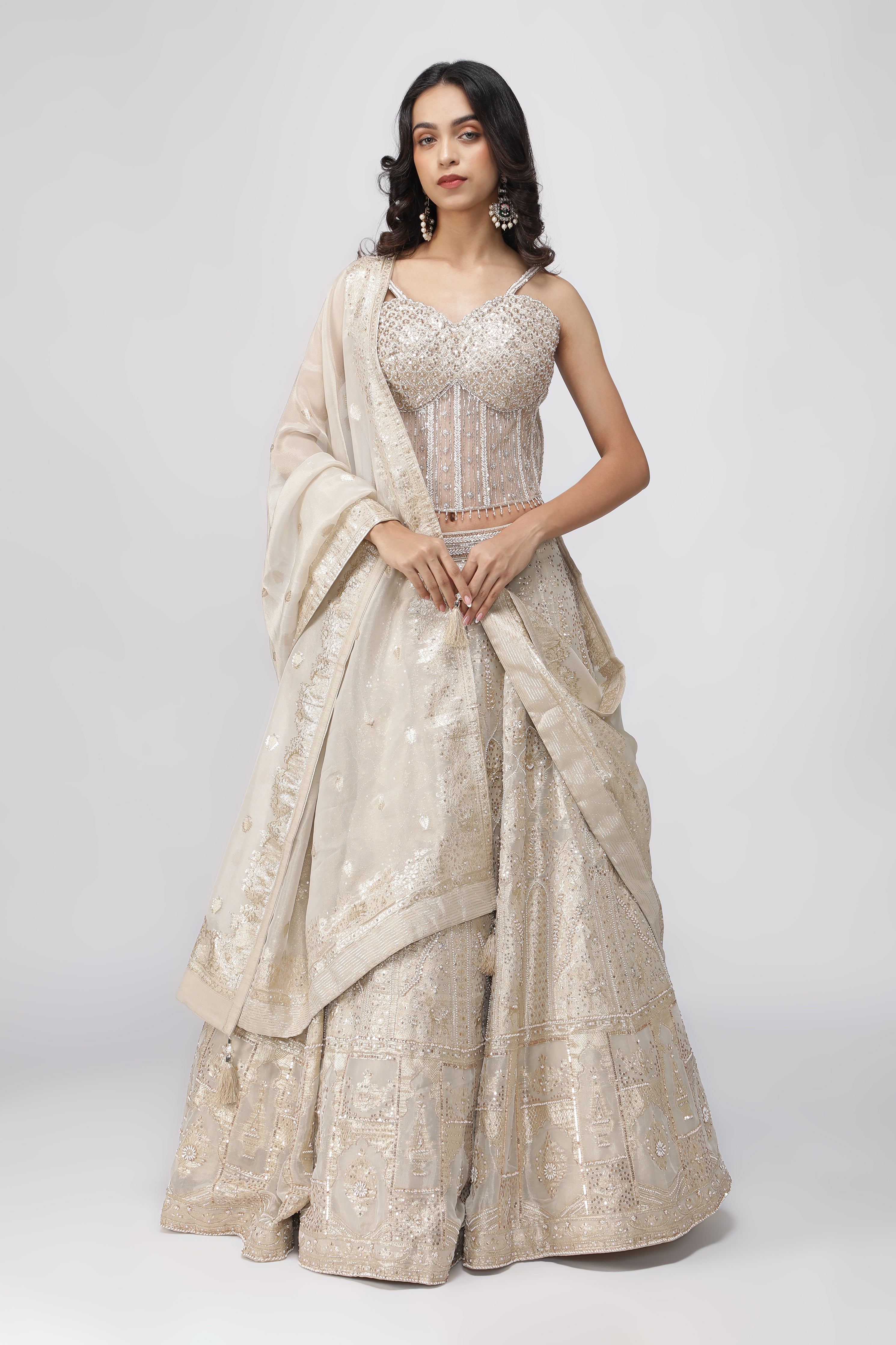 Ivory Banarasi Tissue Lehenga with Pearl Embellished Corset Blouse