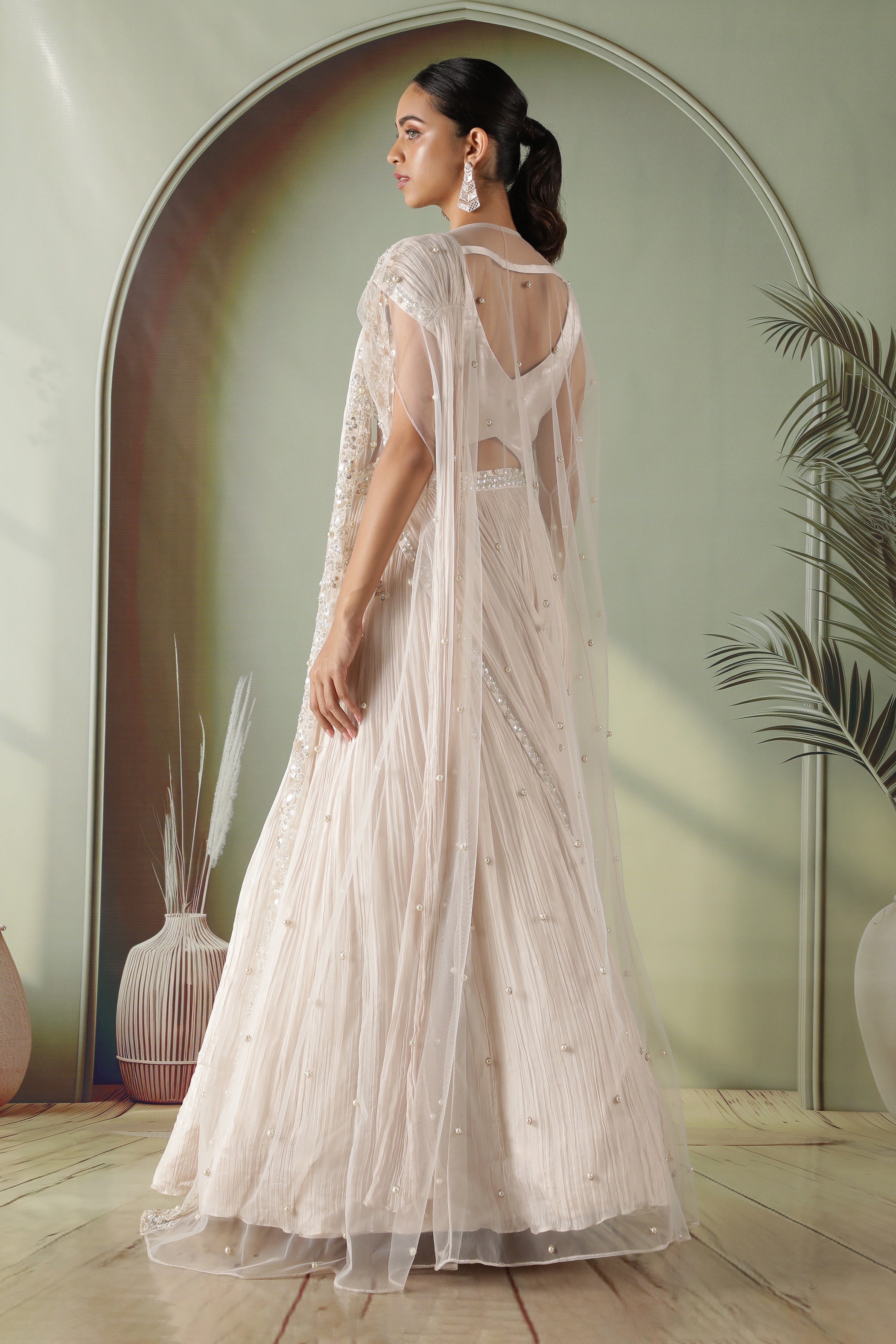 Ivory Silk Lehenga with Draped Dupatta and Embellished Net Cape