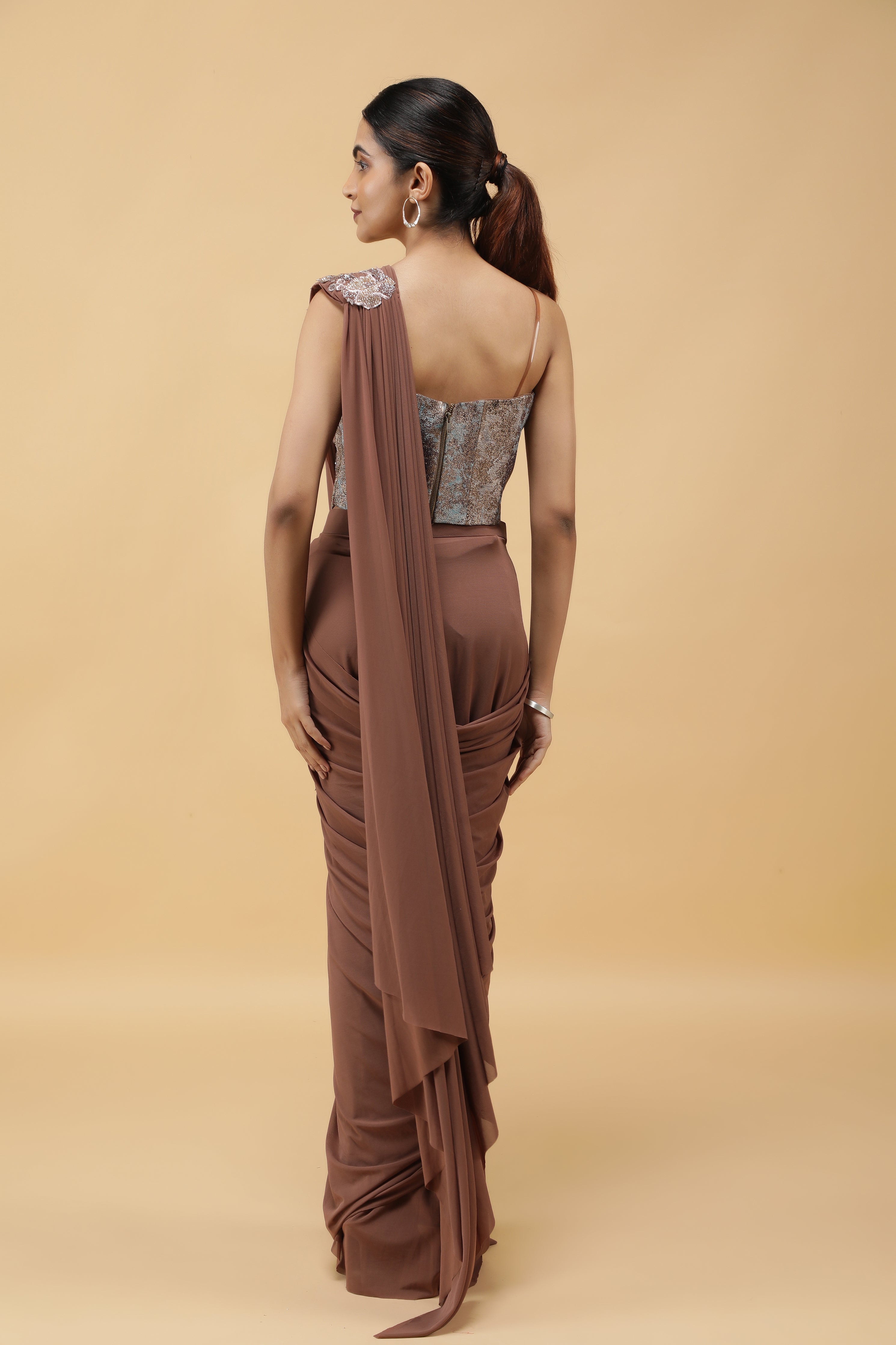 Mocha Lycra Net Drape Saree with Pastel Embroidered Corset Blouse