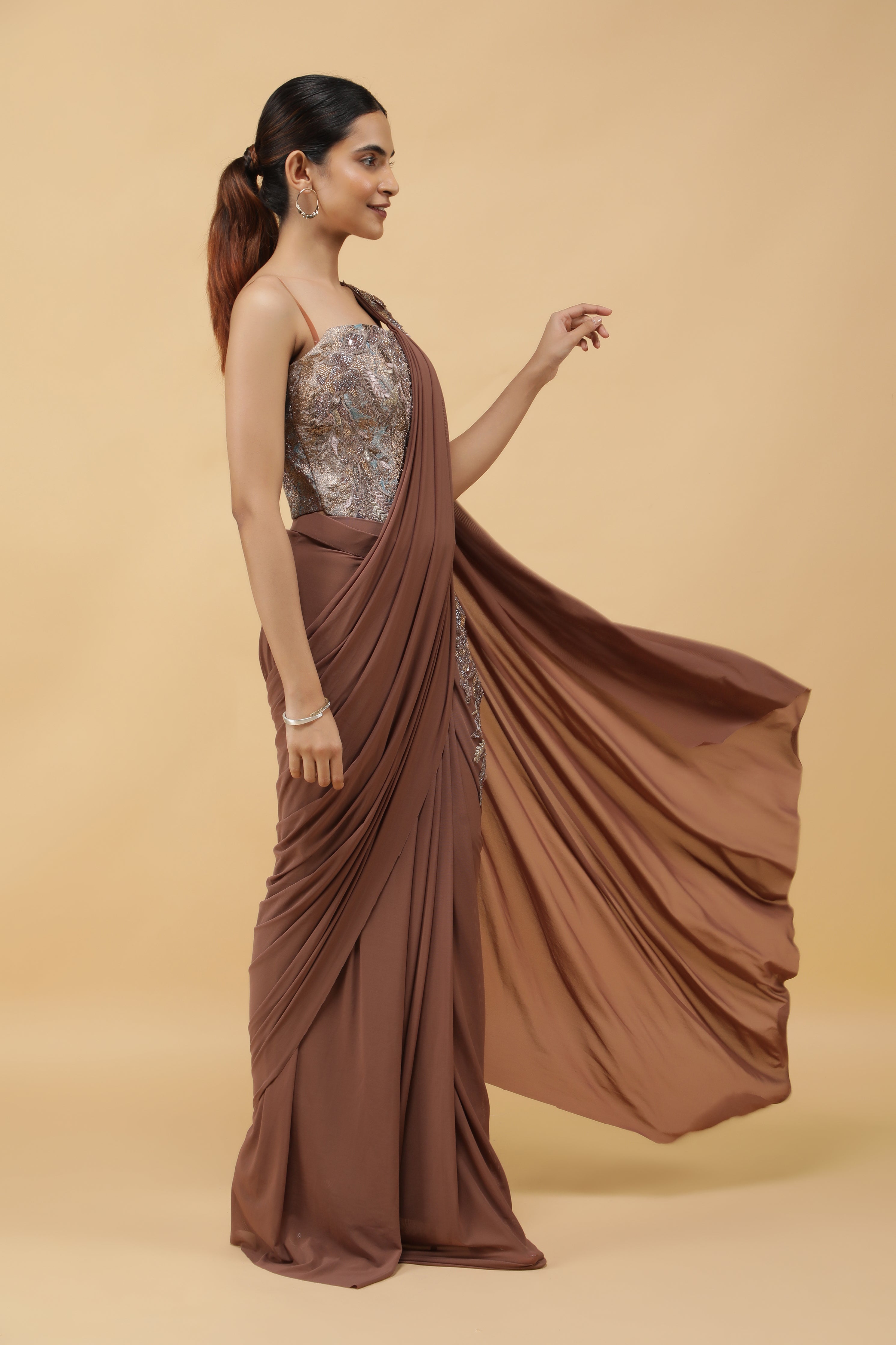 Mocha Lycra Net Drape Saree with Pastel Embroidered Corset Blouse