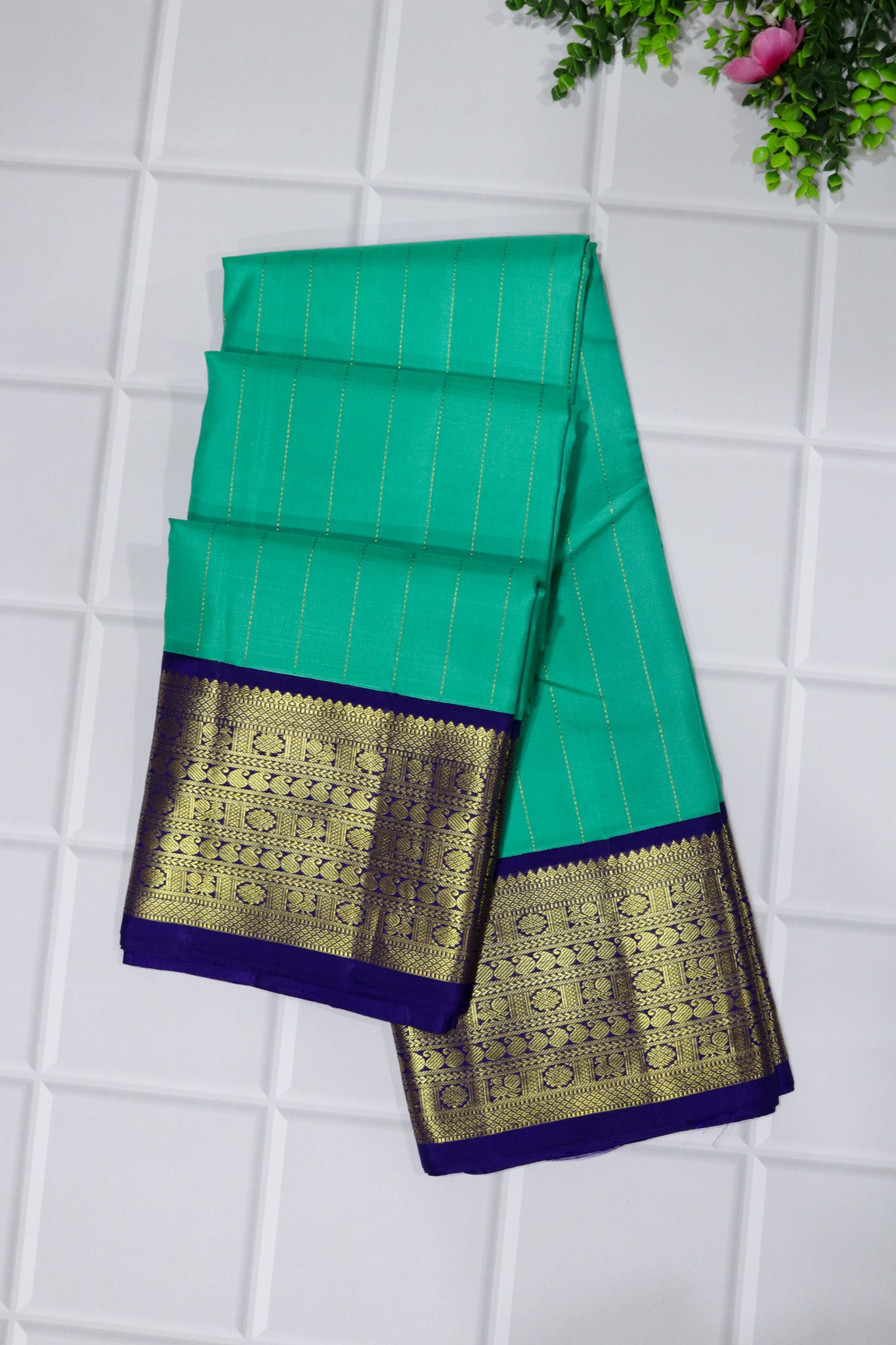 Emerald Green Kanchivaram Silk Saree with Zari Stripes and Contrast Navy Blue Border