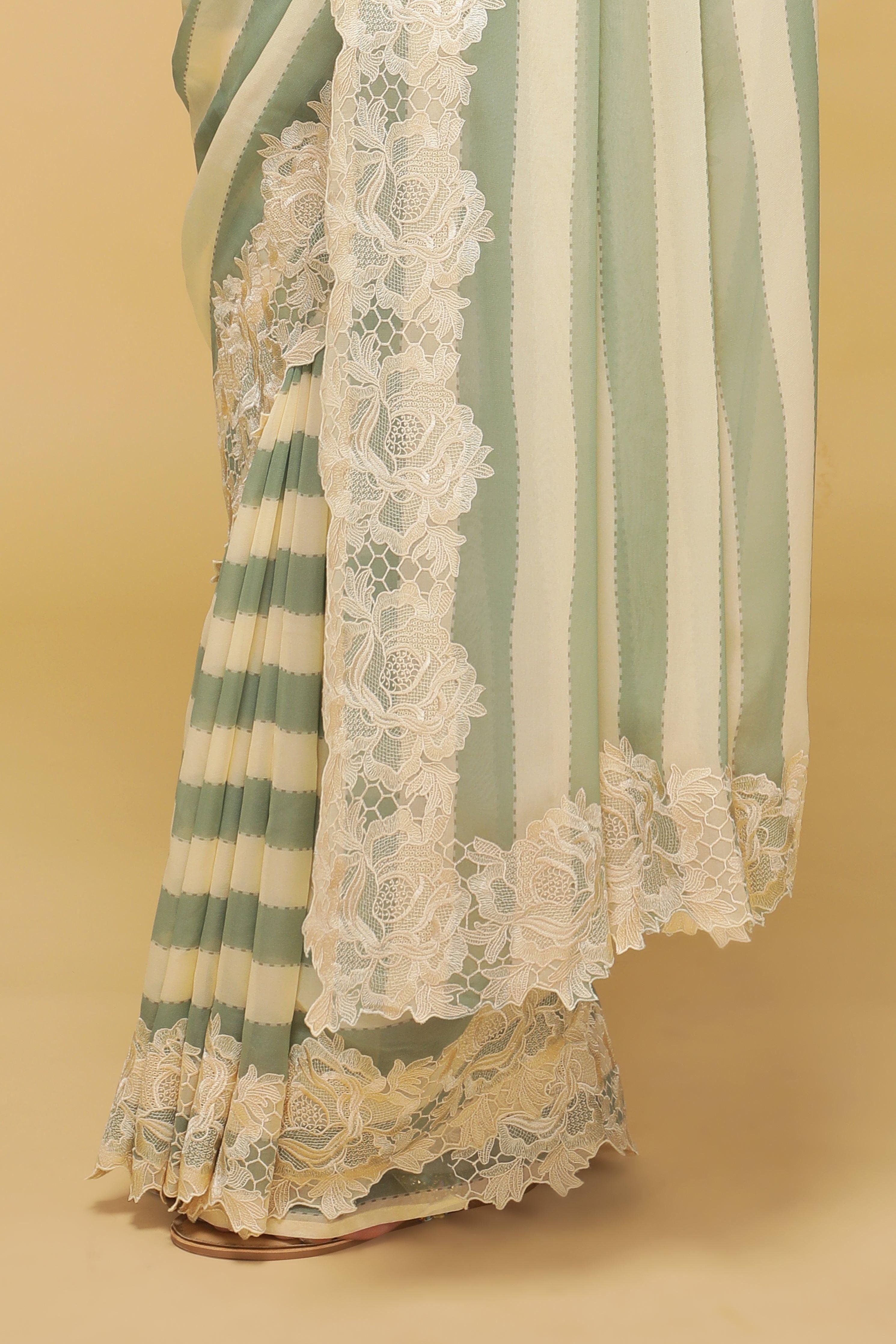 Green & Off-White Striped Georgette Saree with Thread Lace Border.