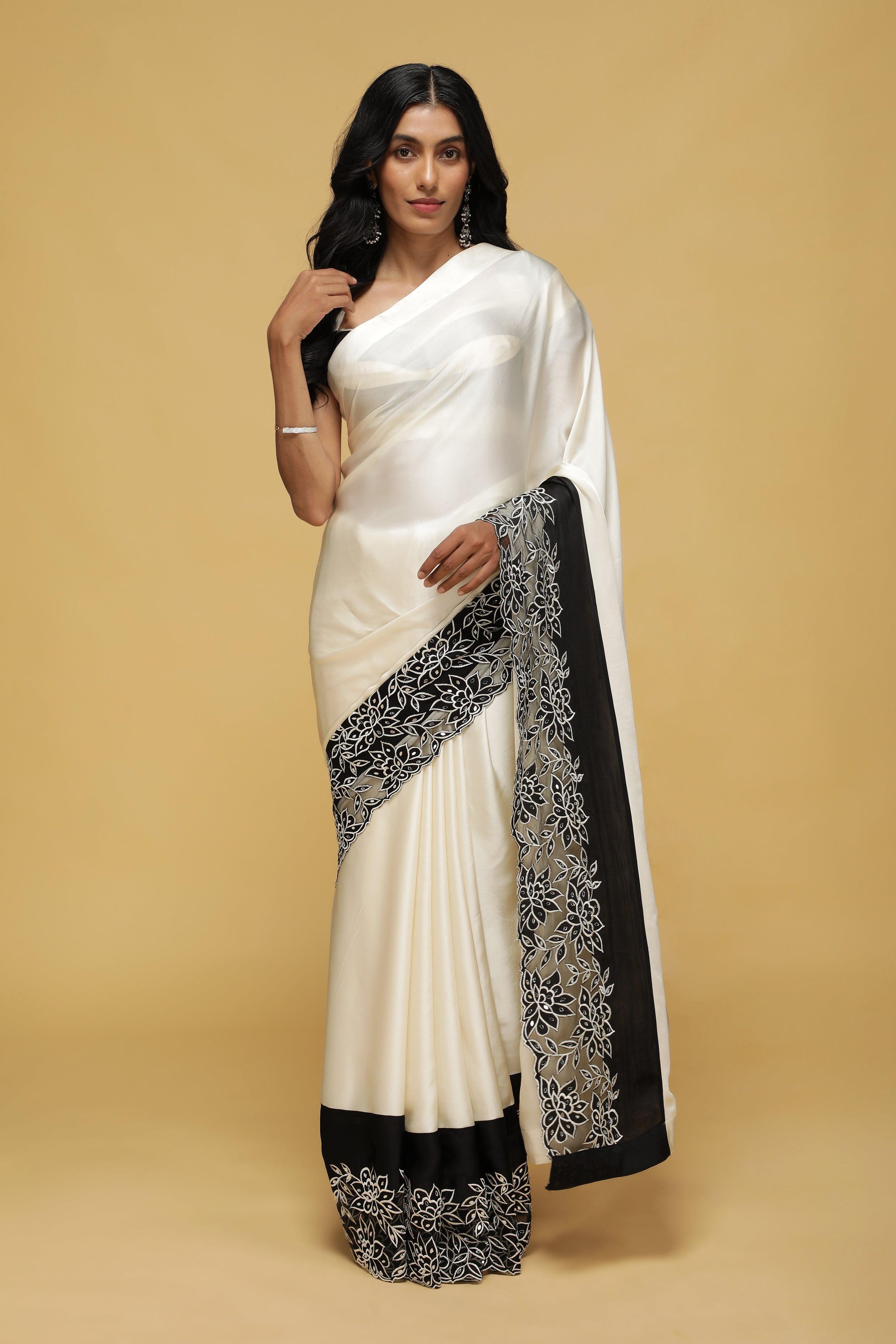 Off-White Satin Saree with Black Mirror & Thread Embroidery Border.
