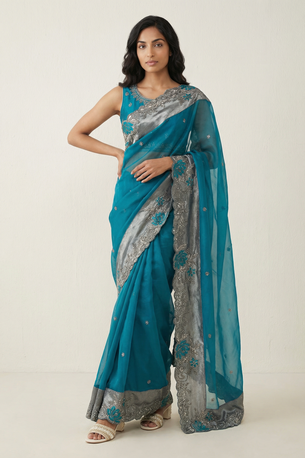 Emerald Green Organza Saree with Antique Sequins & Beaded Tissue Border