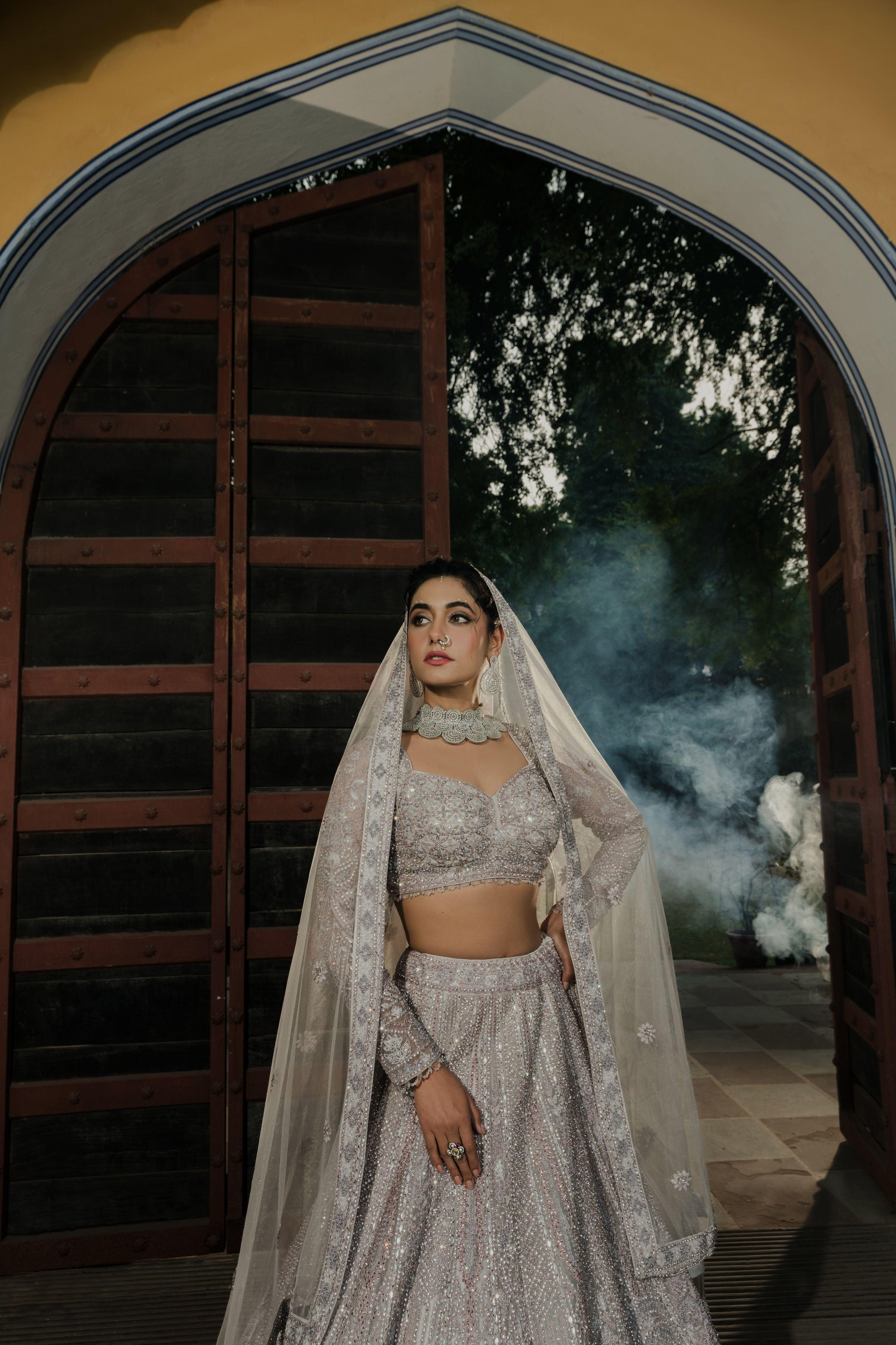 Pastel Grey Net Lehenga with Intricate Sequin Work  Mokshaa