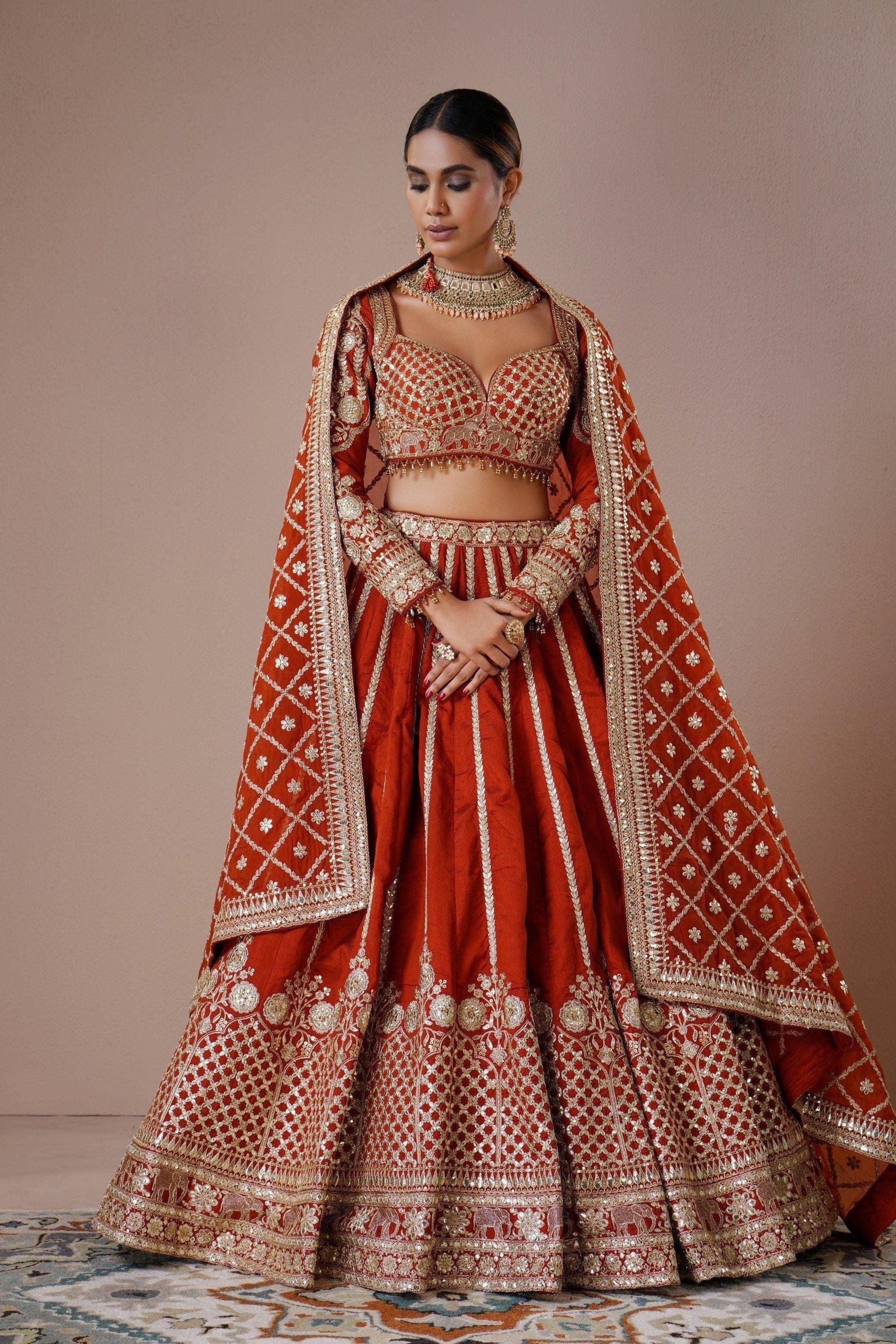 Rust Raw Silk Lehenga with Mirror and Zardosi Embroidery  Mokshaa