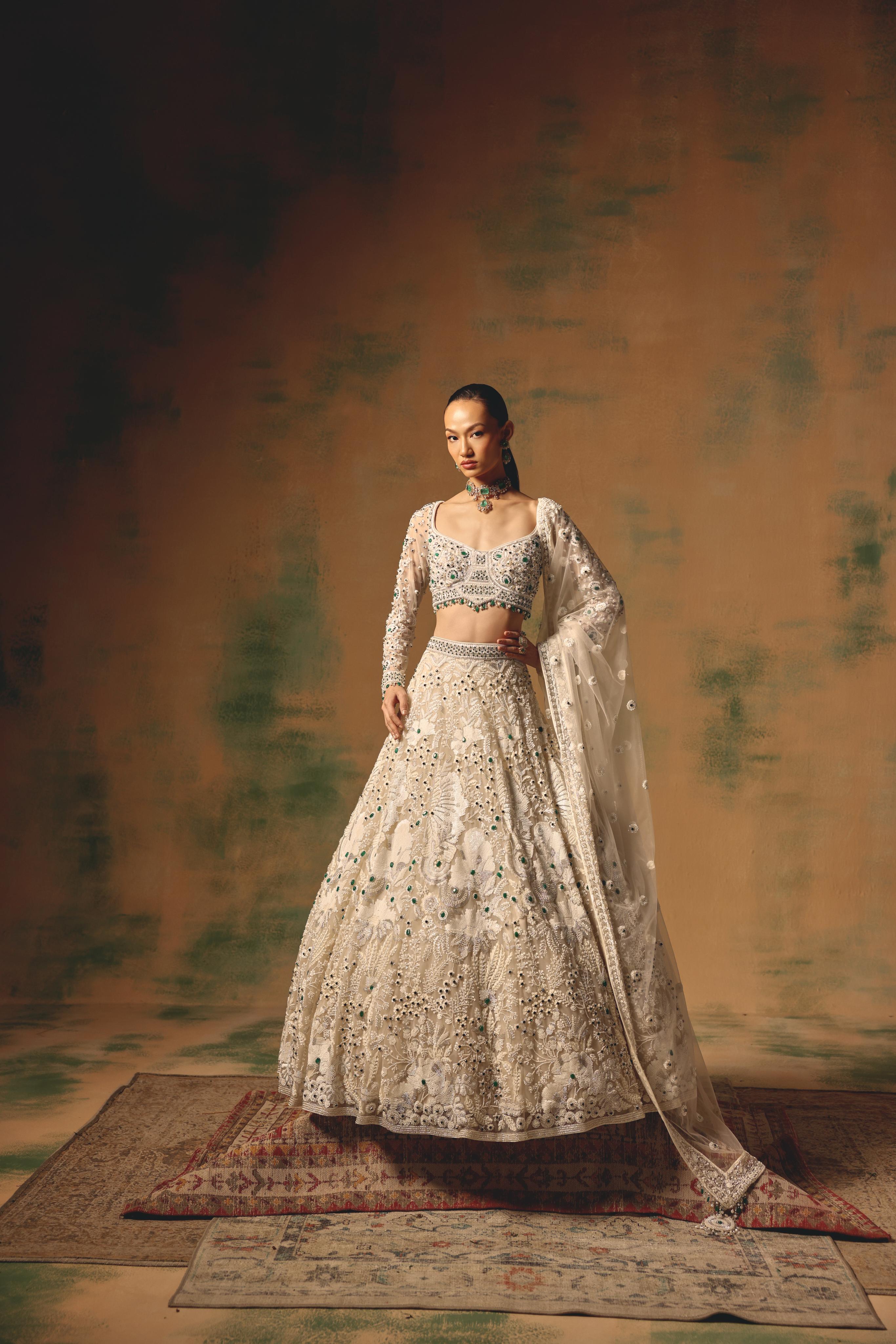 Ivory Net Lehenga with Emerald Embellishments