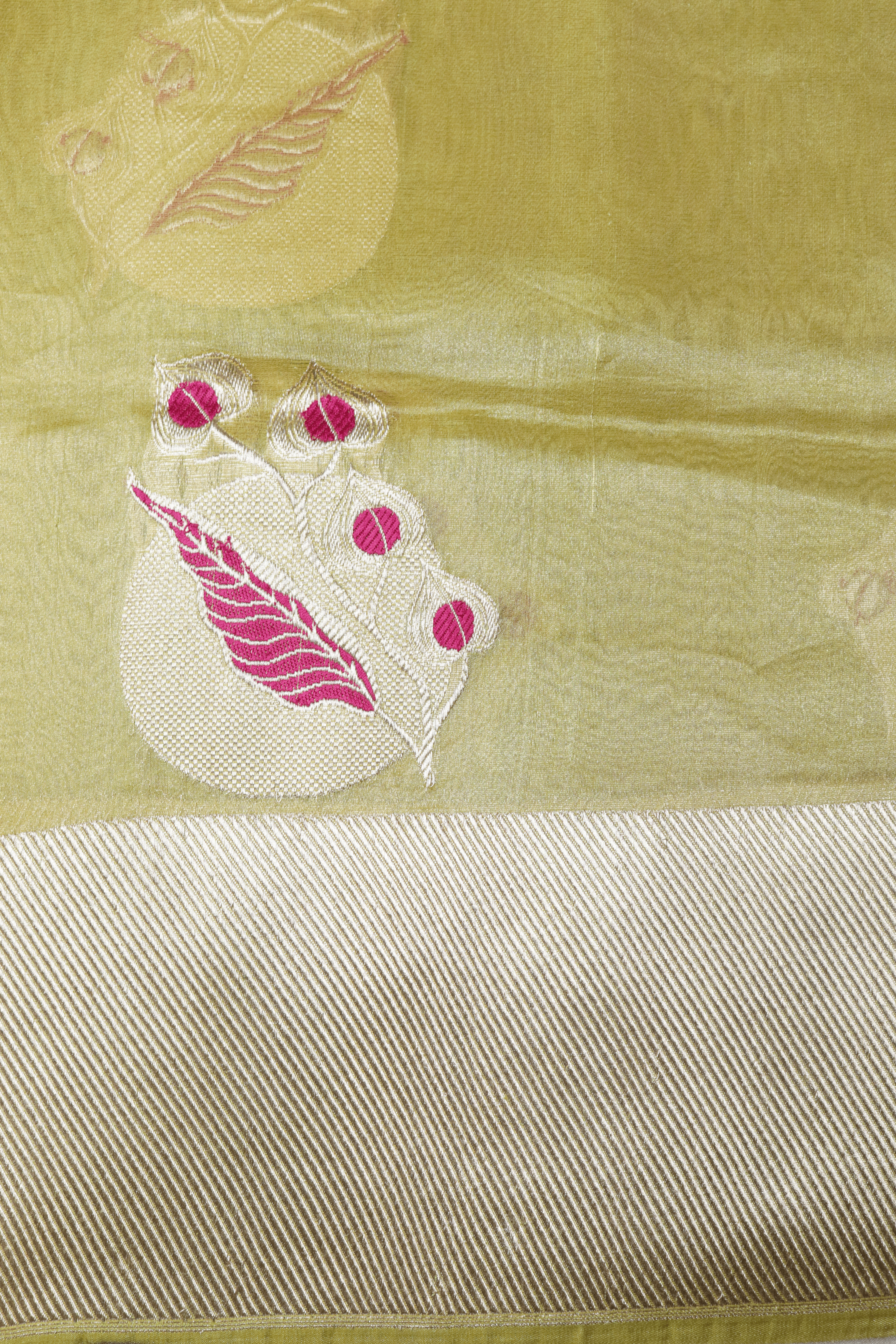 Olive Green Tissue Kora Saree with Cream Zari Border & Pink Leaf Motifs  Mokshaa
