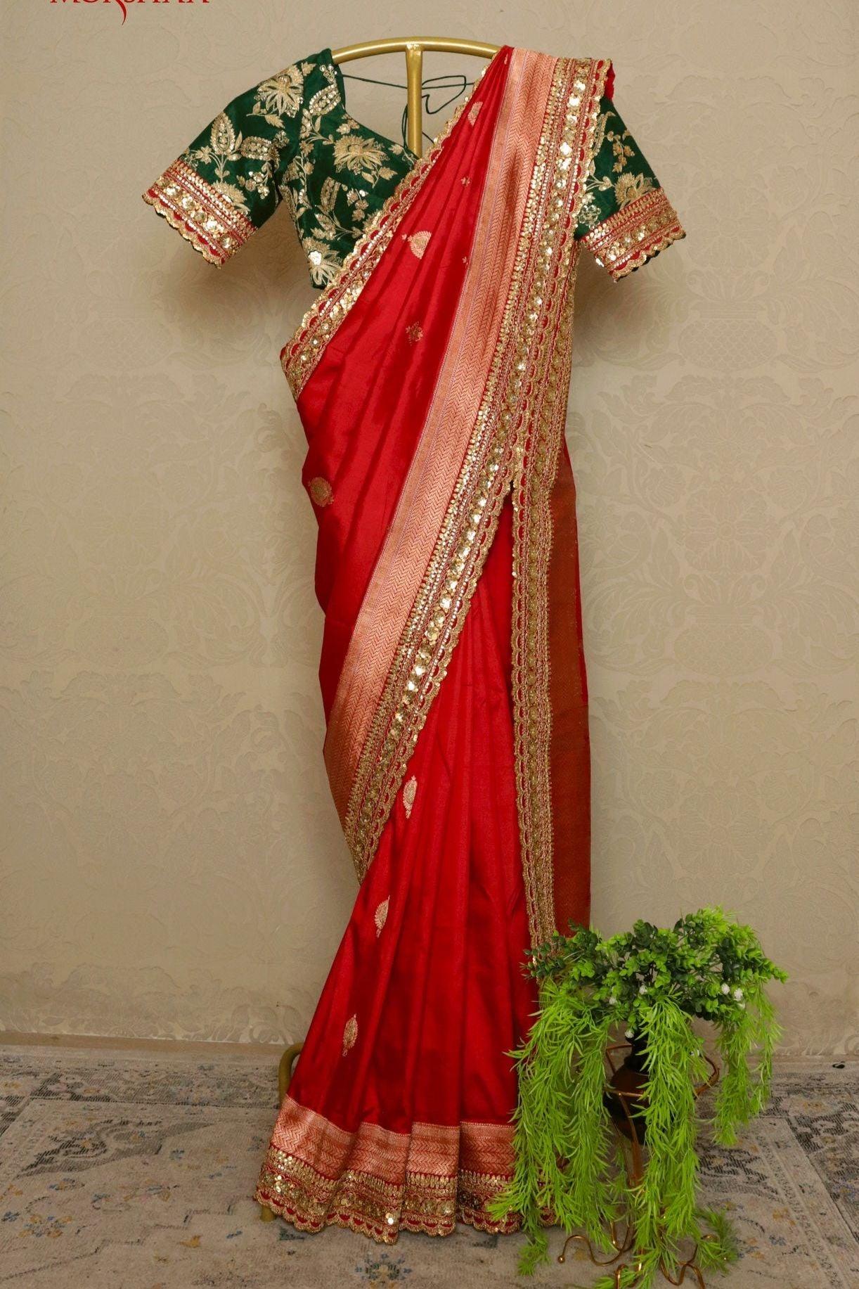 Red Banarasi Silk Saree with Kaduwa Buttas & Sequin Border.
