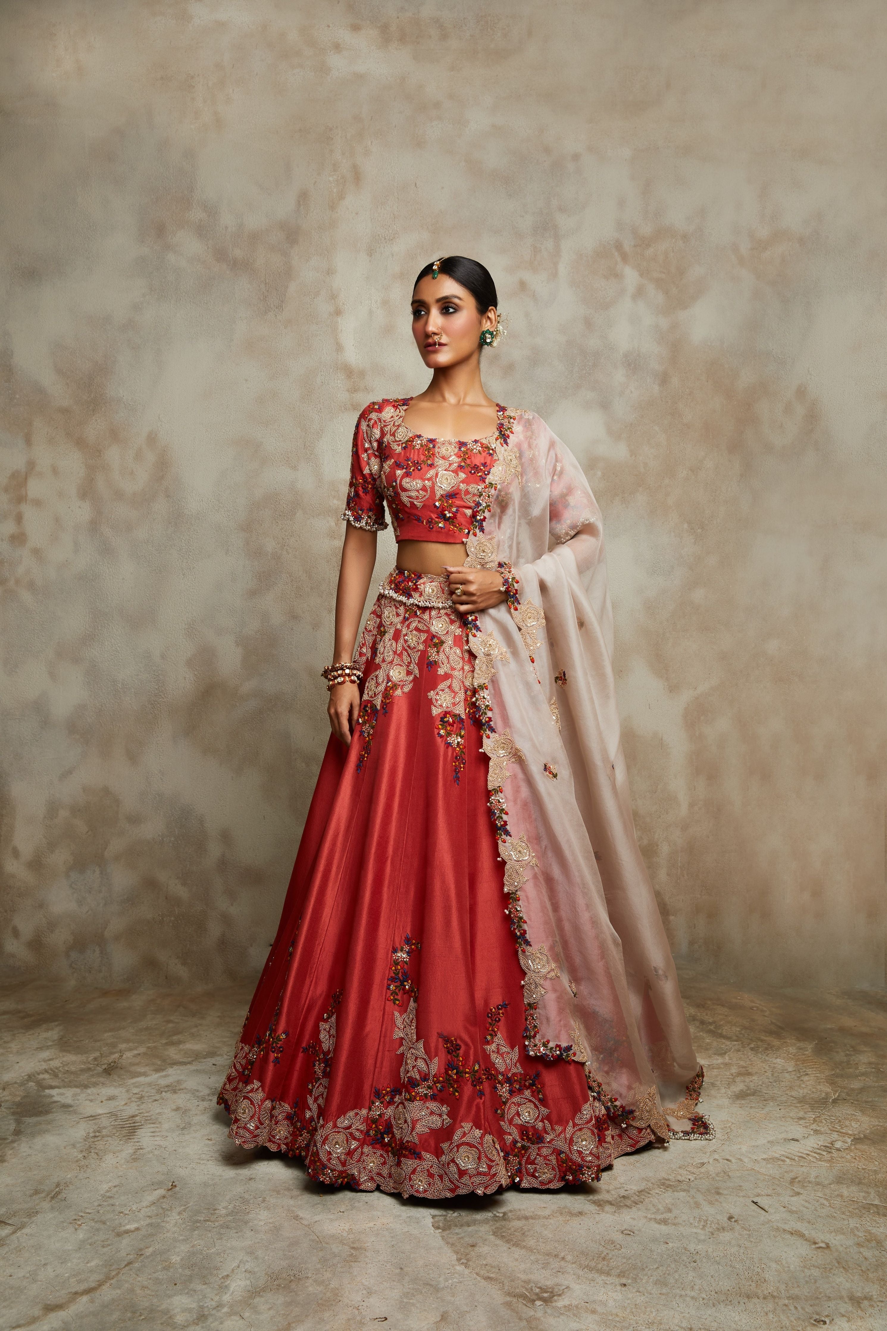 Burnt orange silk blouse and lehenga with champagne organza dupatta  Mokshaa