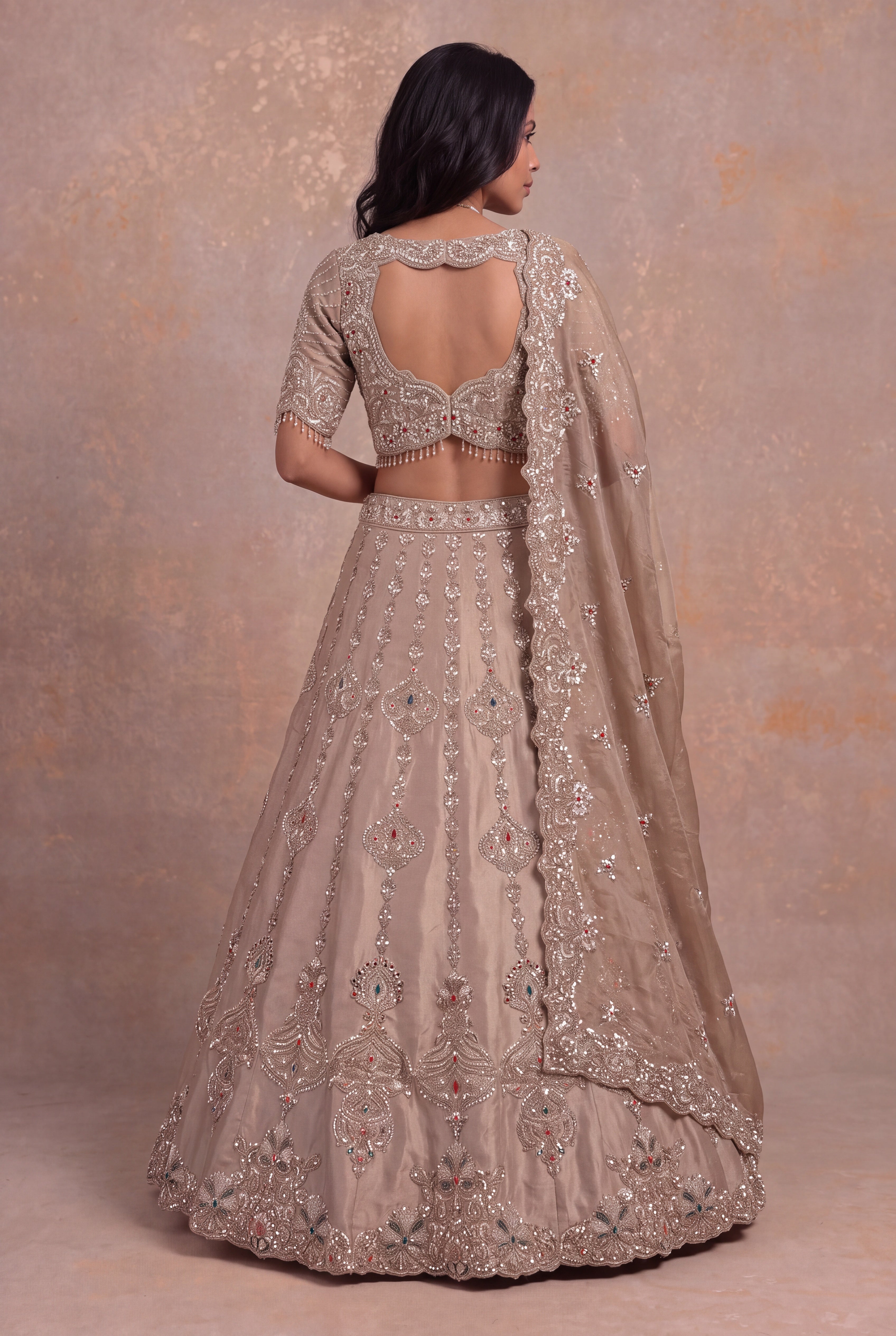 Golden Tissue Lehenga with Multicolour Kundan & Sequin Embroidery