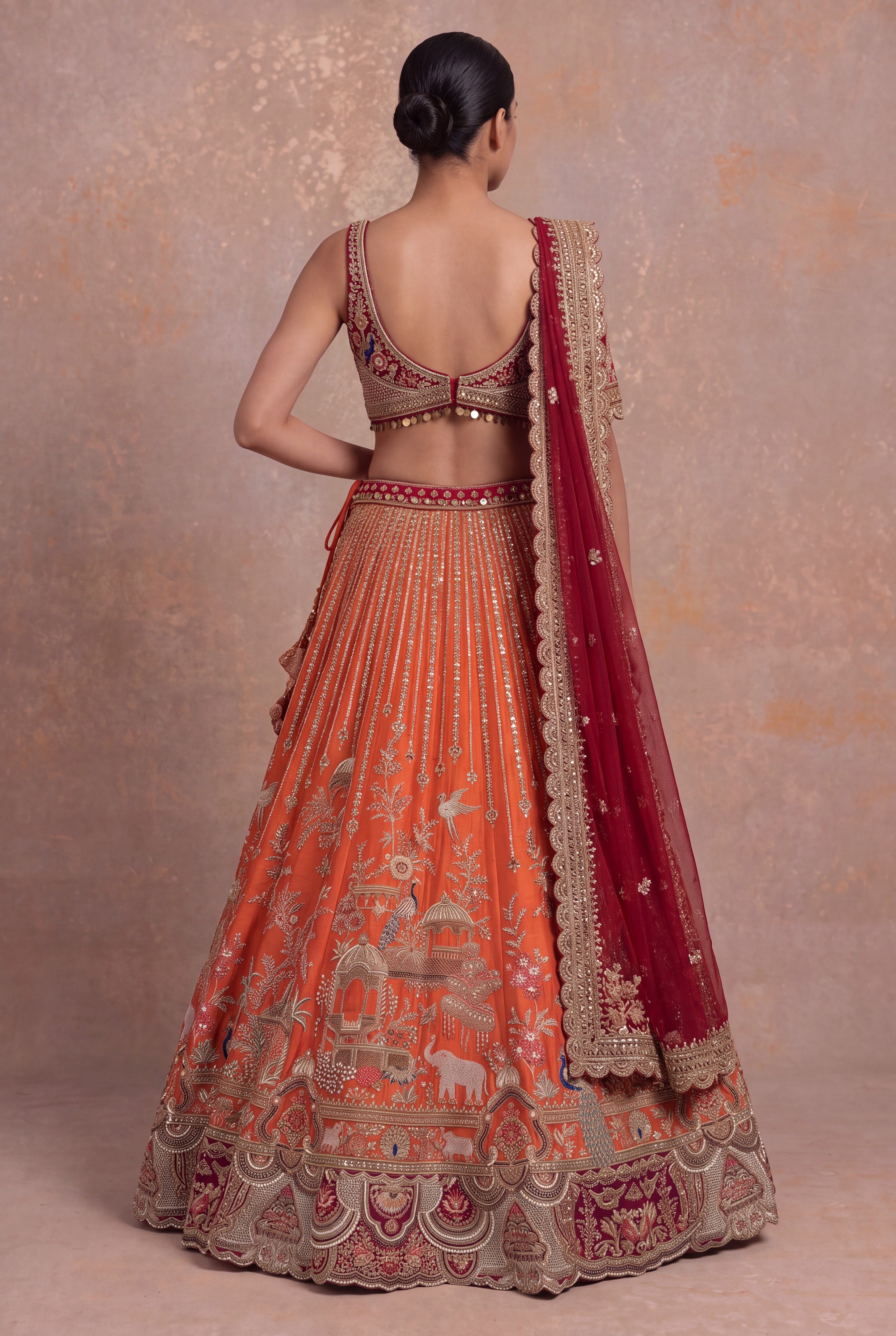 Rust Orange Raw Silk Bridal Lehenga with Zardozi Palace Motifs