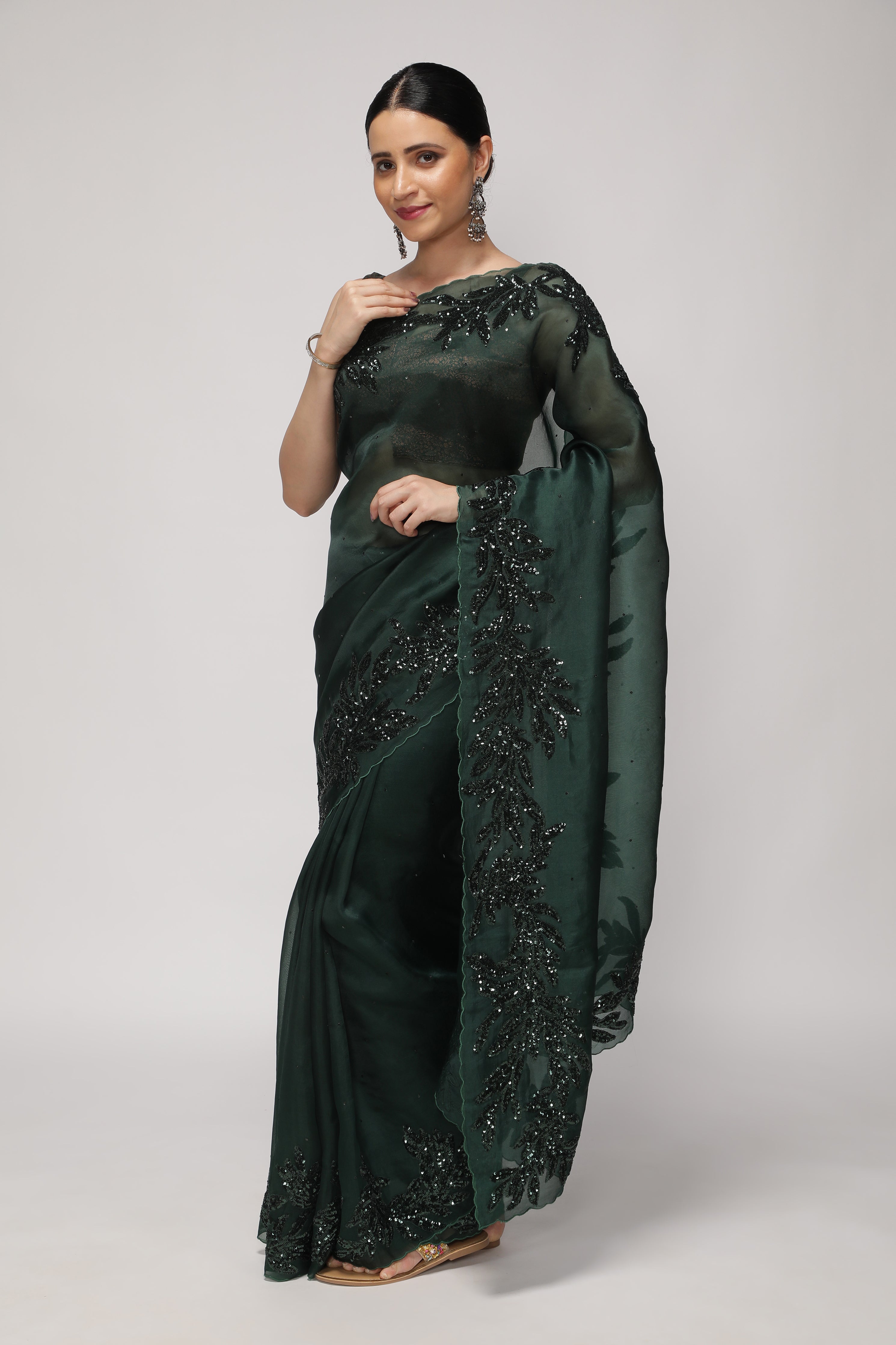 Bottle Green Organza Saree with Self Sequins & Floral Highlight Border