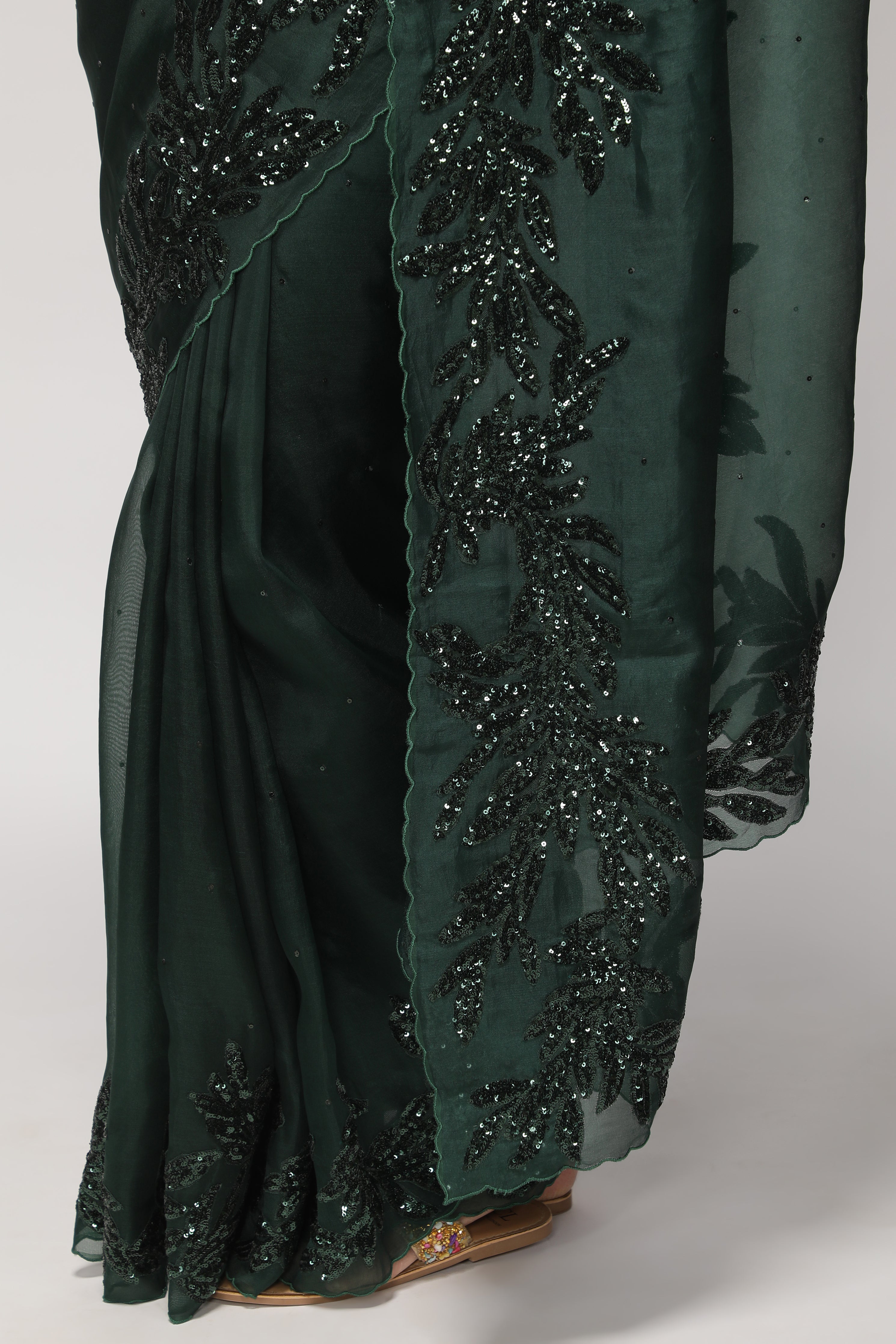 Bottle Green Organza Saree with Self Sequins & Floral Highlight Border