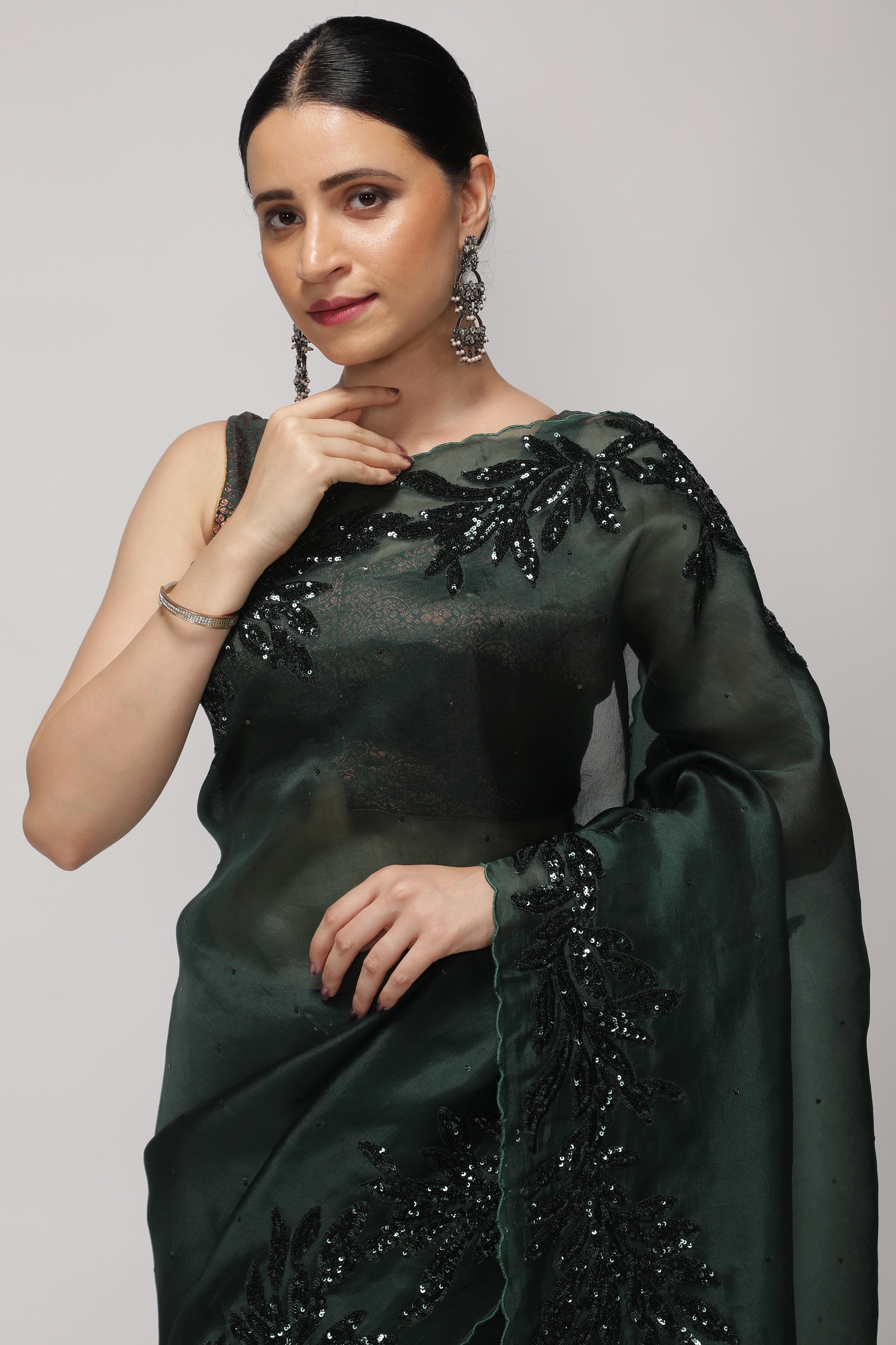 Bottle Green Organza Saree with Self Sequins & Floral Highlight Border
