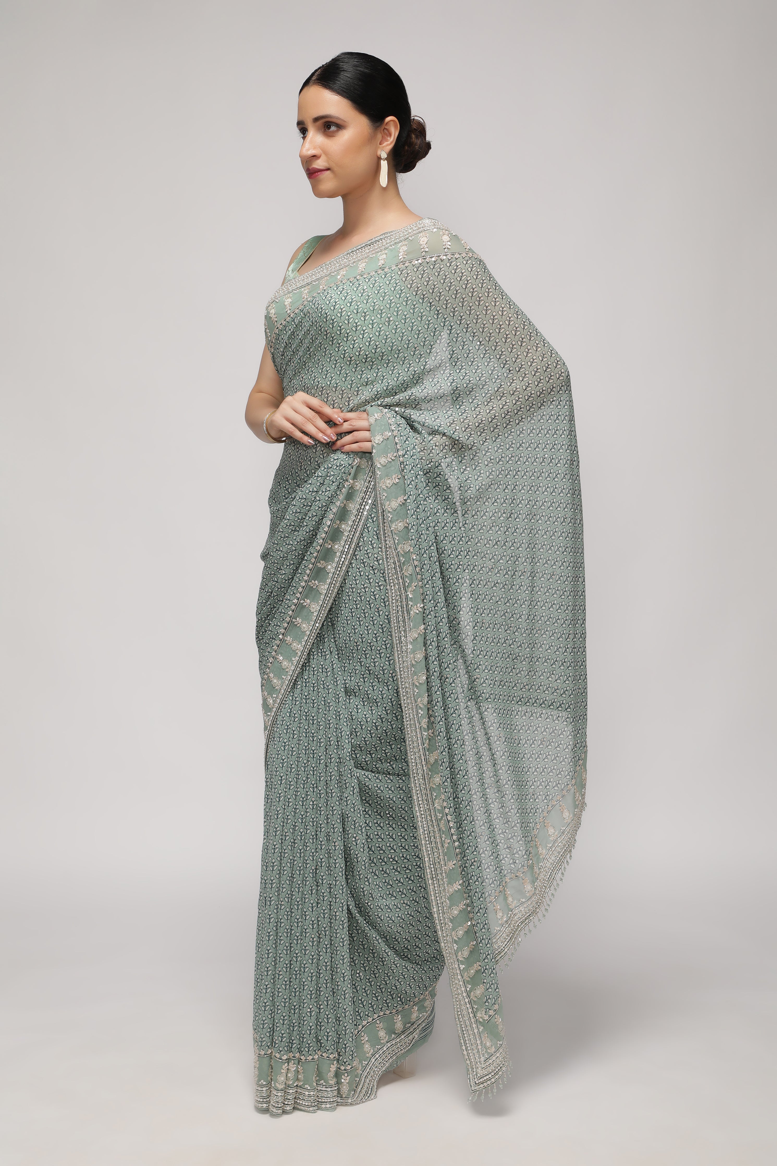 Mint Blue Georgette Saree with Printed Sequins Highlight Body and Sequins Border