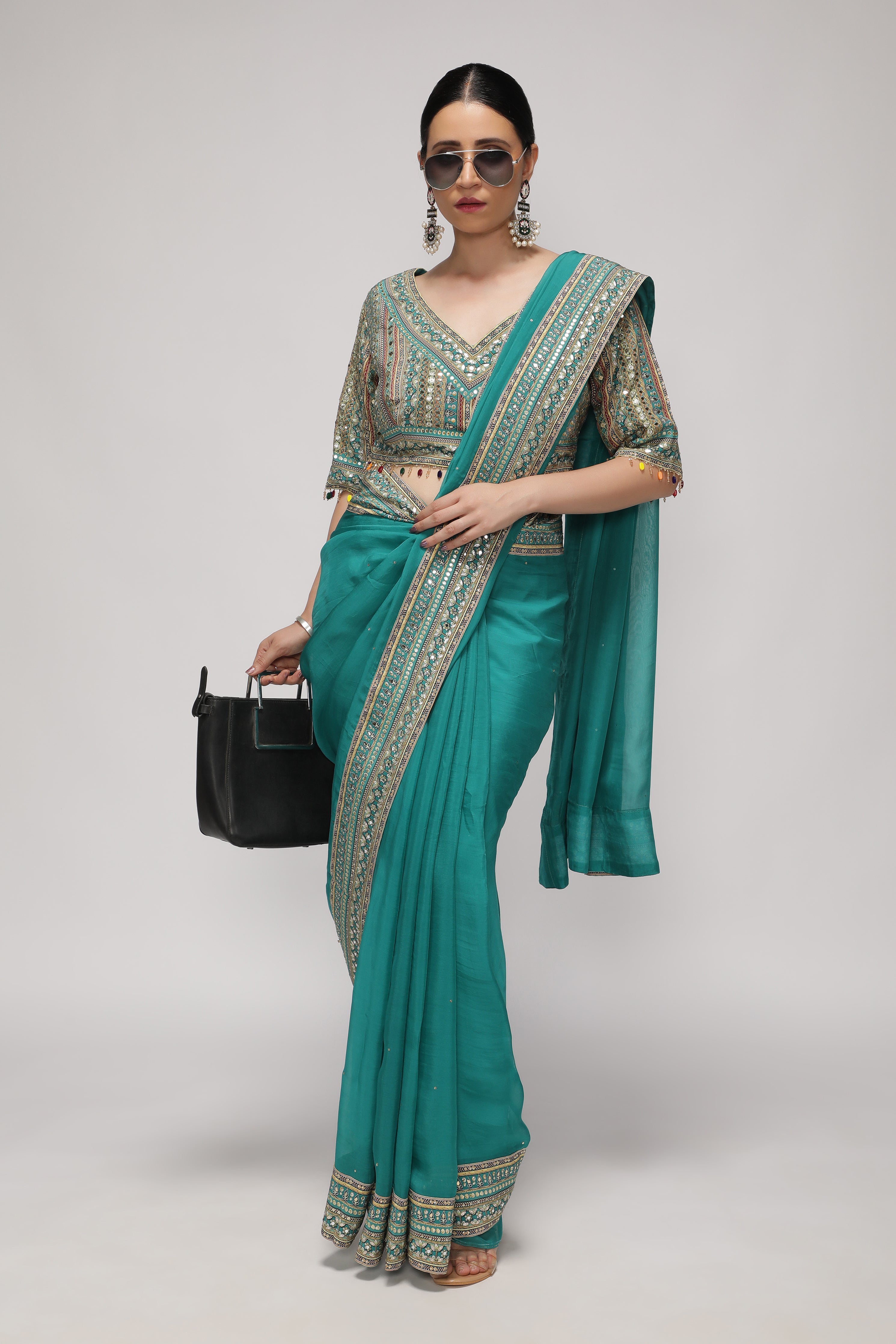Teal Green Silk Organza Saree with Sequin Highlights & Mirror Work Border