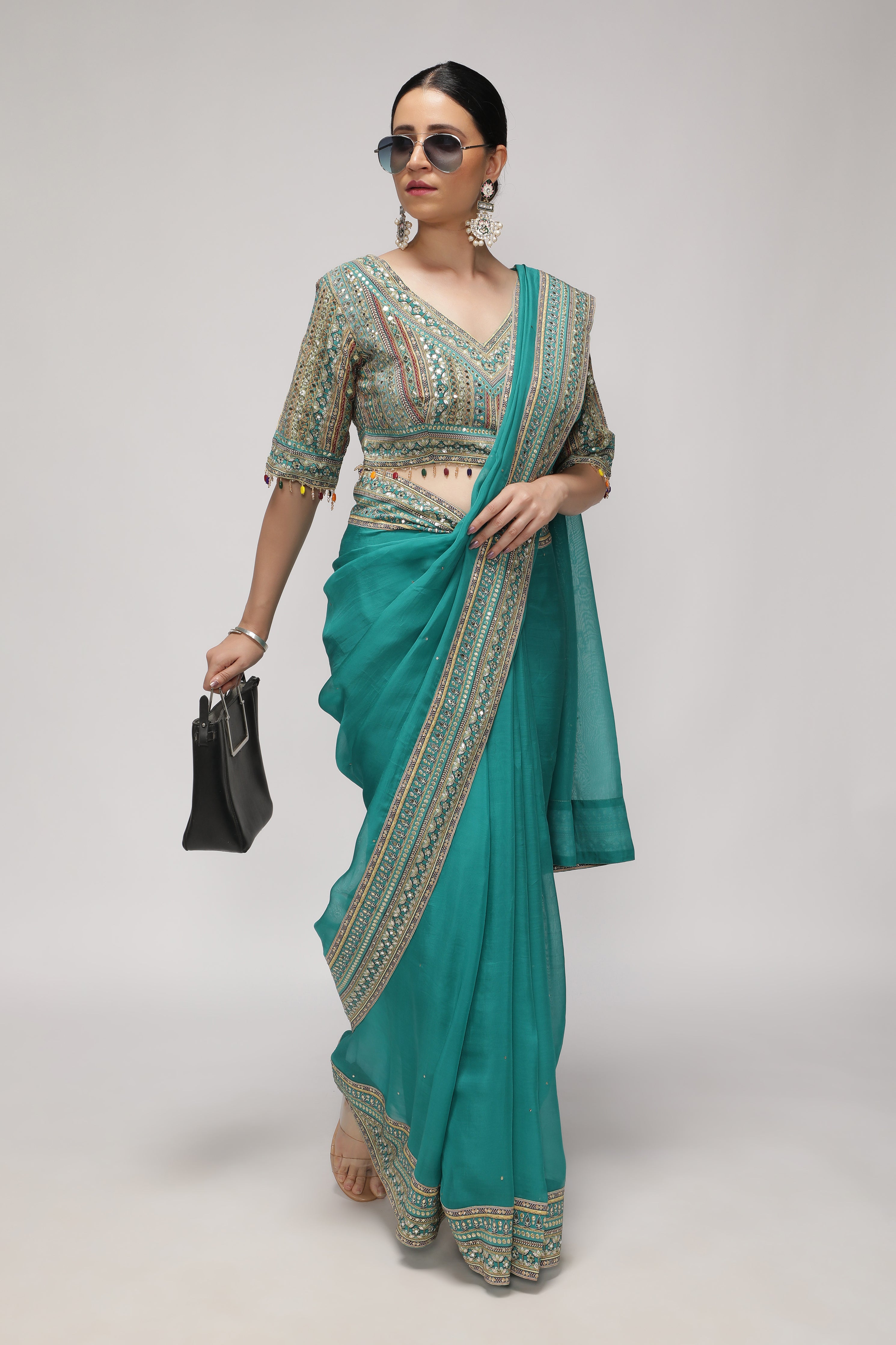 Teal Green Silk Organza Saree with Sequin Highlights & Mirror Work Border