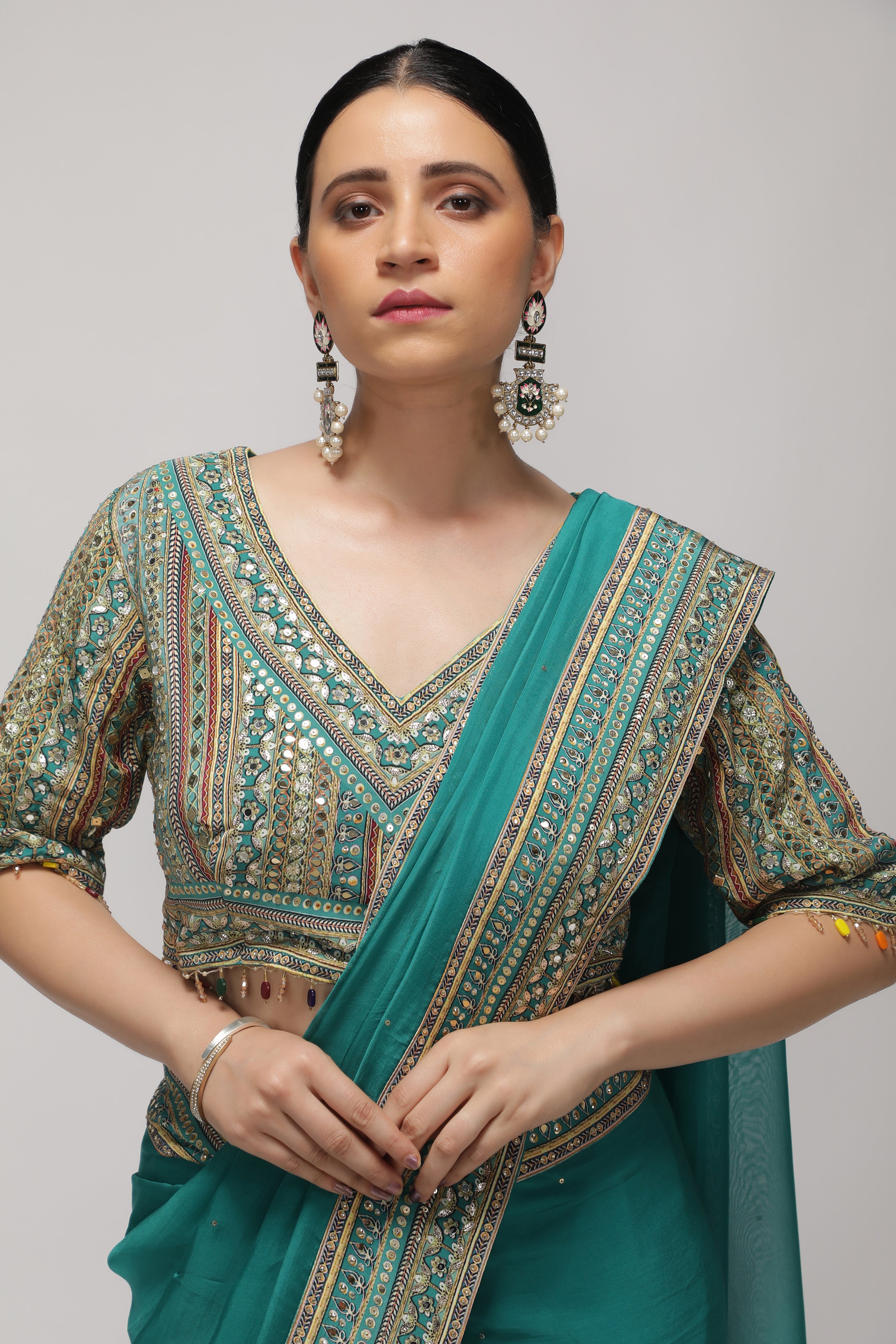 Teal Green Silk Organza Saree with Sequin Highlights & Mirror Work Border