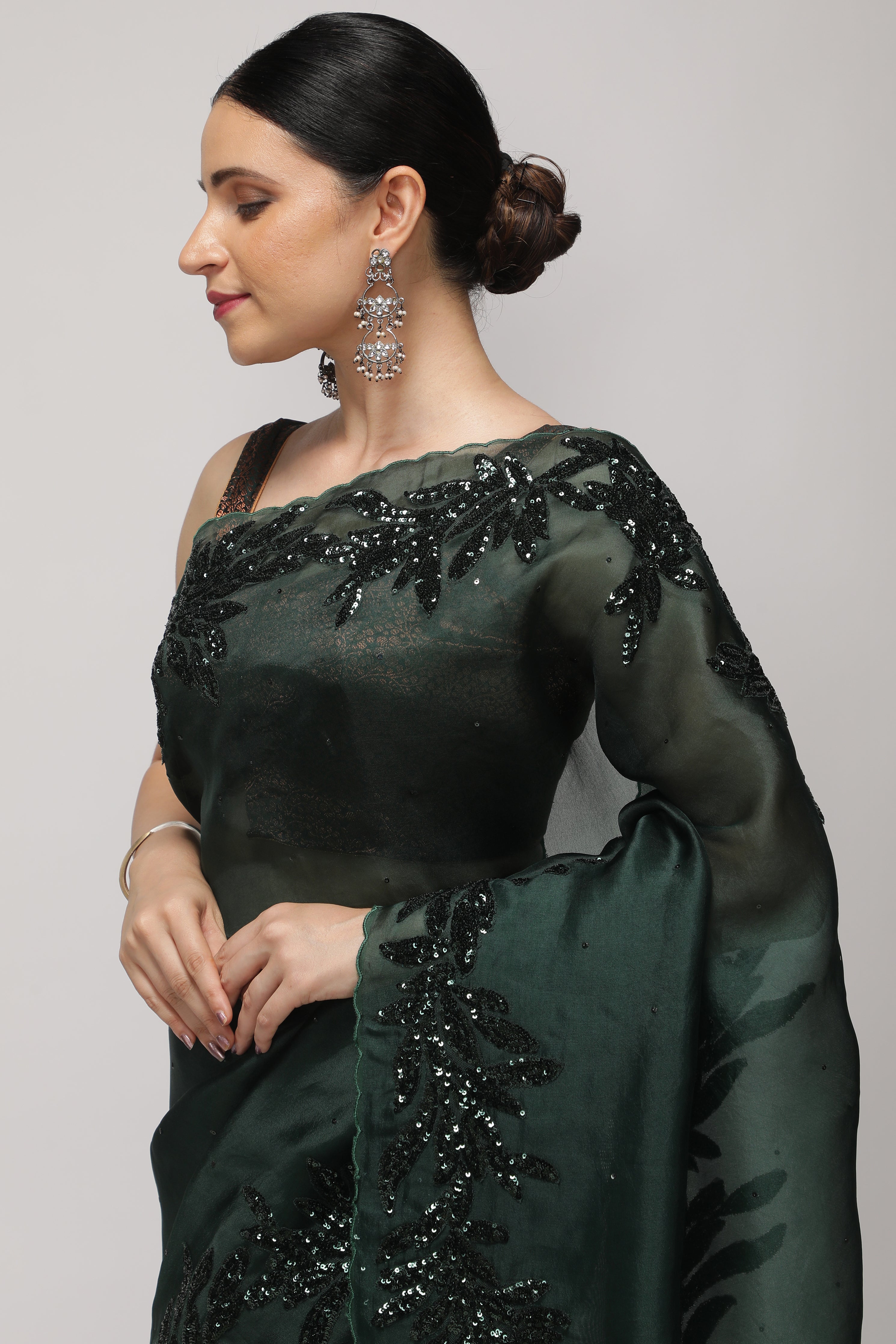 Bottle Green Organza Saree with Self Sequins & Floral Highlight Border