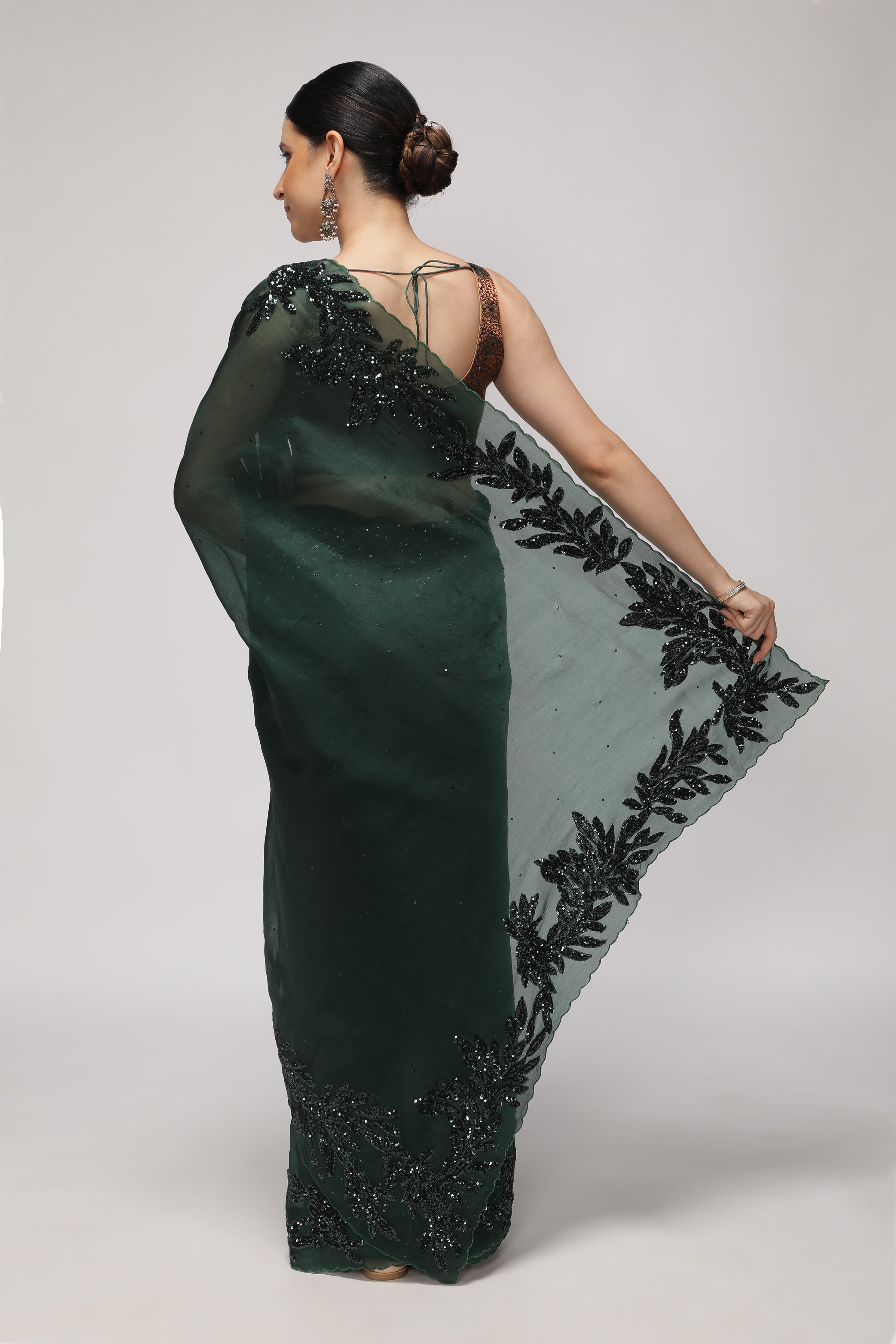 Bottle Green Organza Saree with Self Sequins & Floral Highlight Border