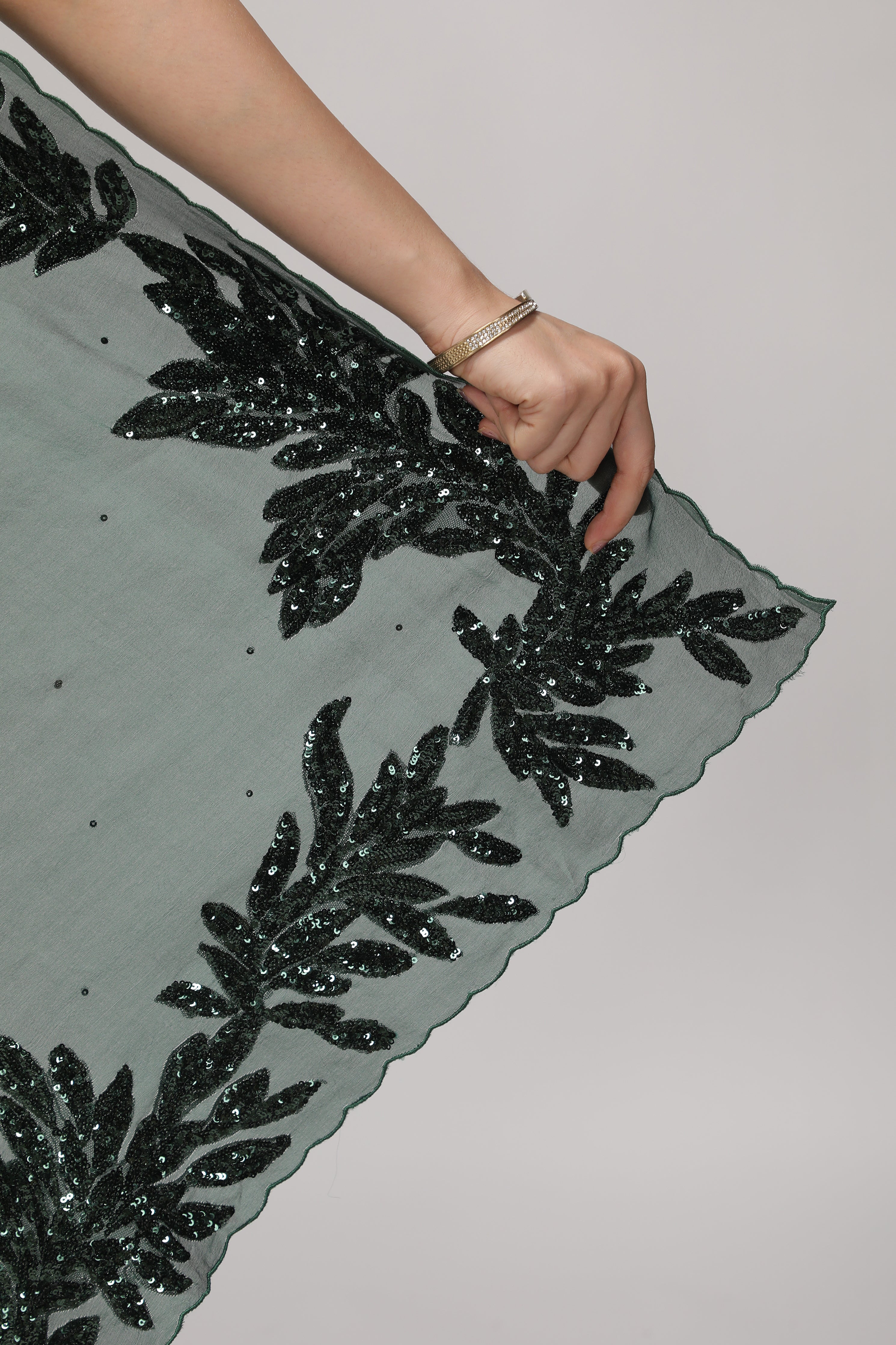 Bottle Green Organza Saree with Self Sequins & Floral Highlight Border