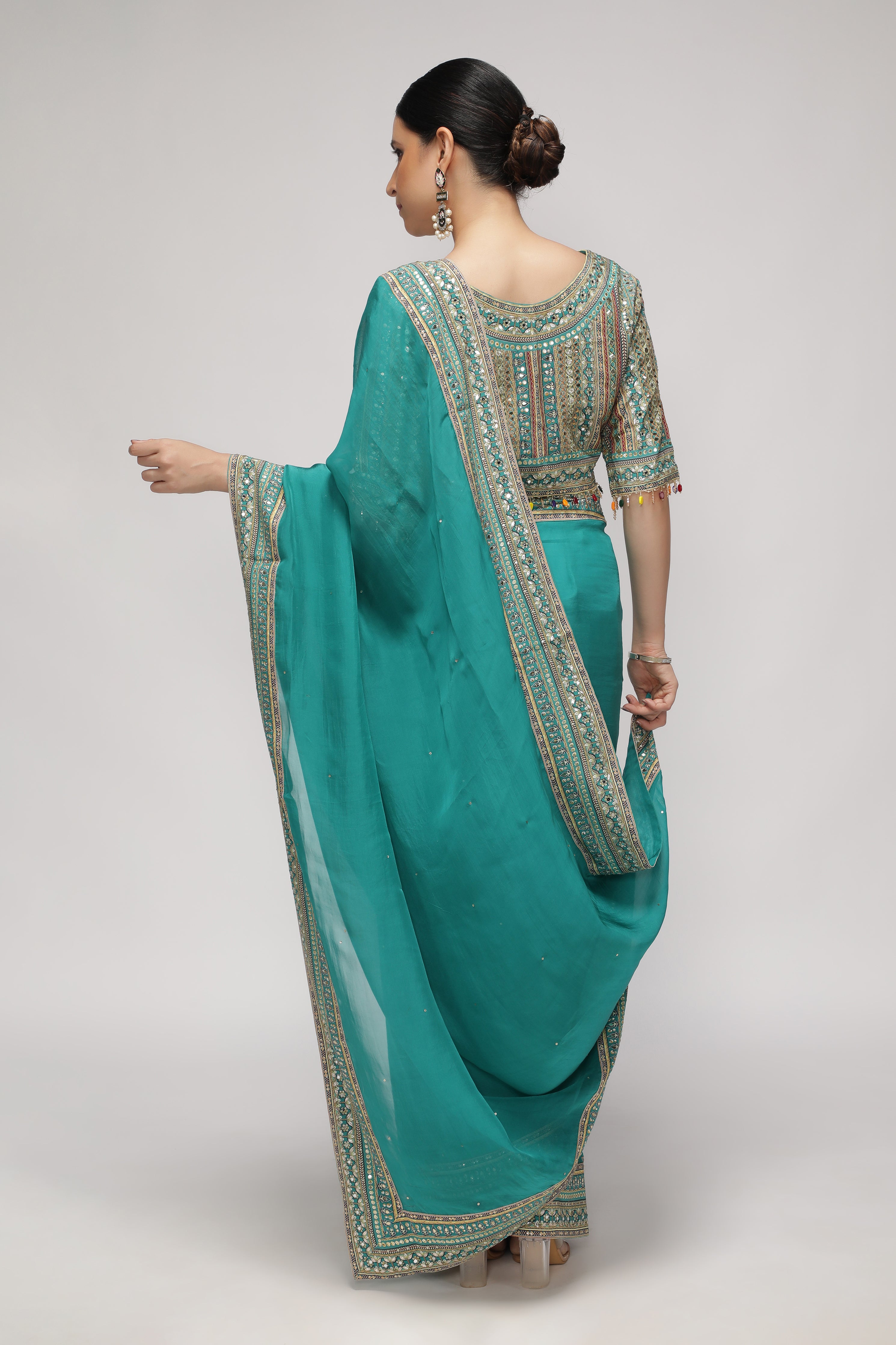 Teal Green Silk Organza Saree with Sequin Highlights & Mirror Work Border