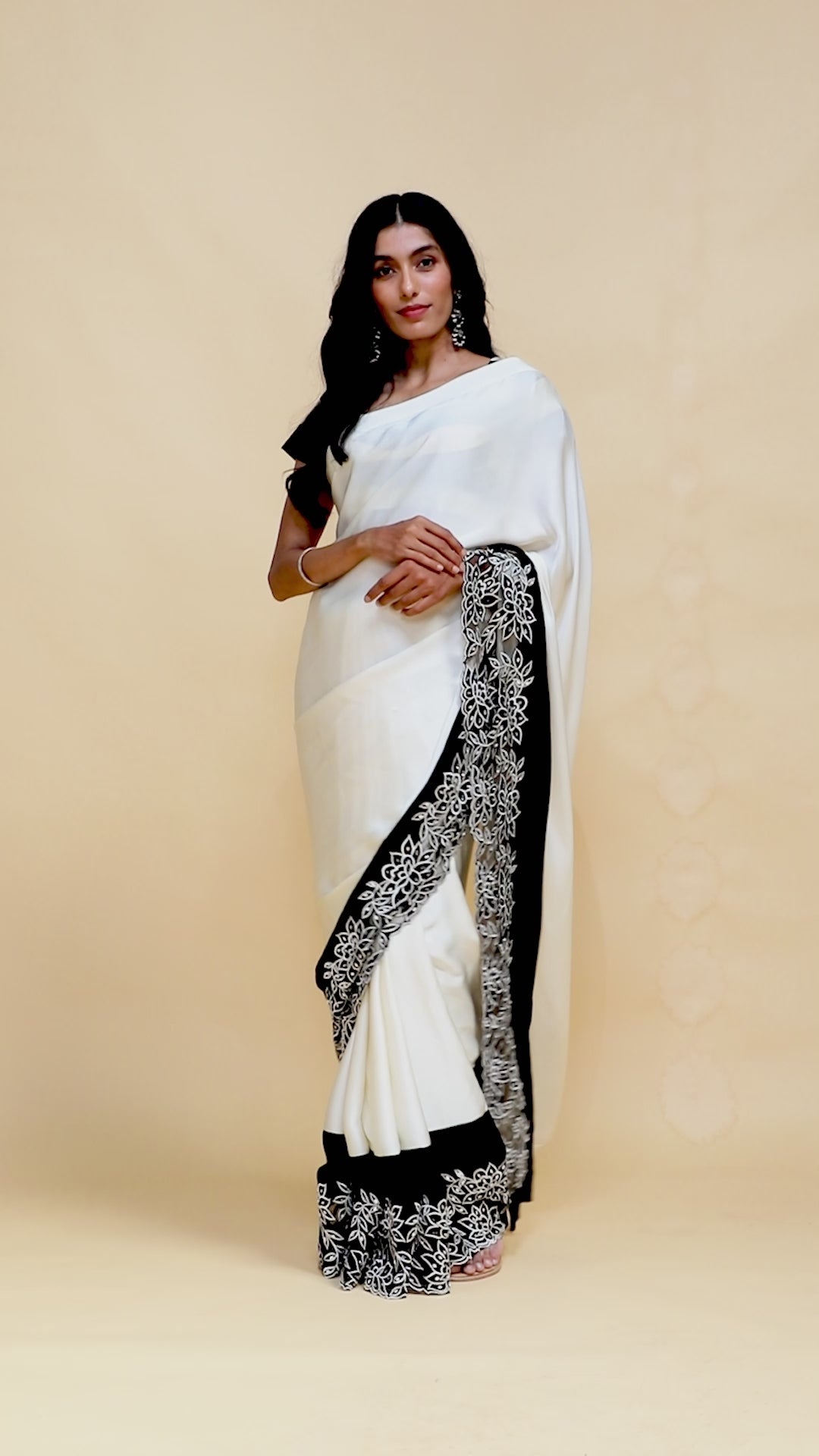 Off-White Satin Saree with Black Mirror & Thread Embroidery Border.